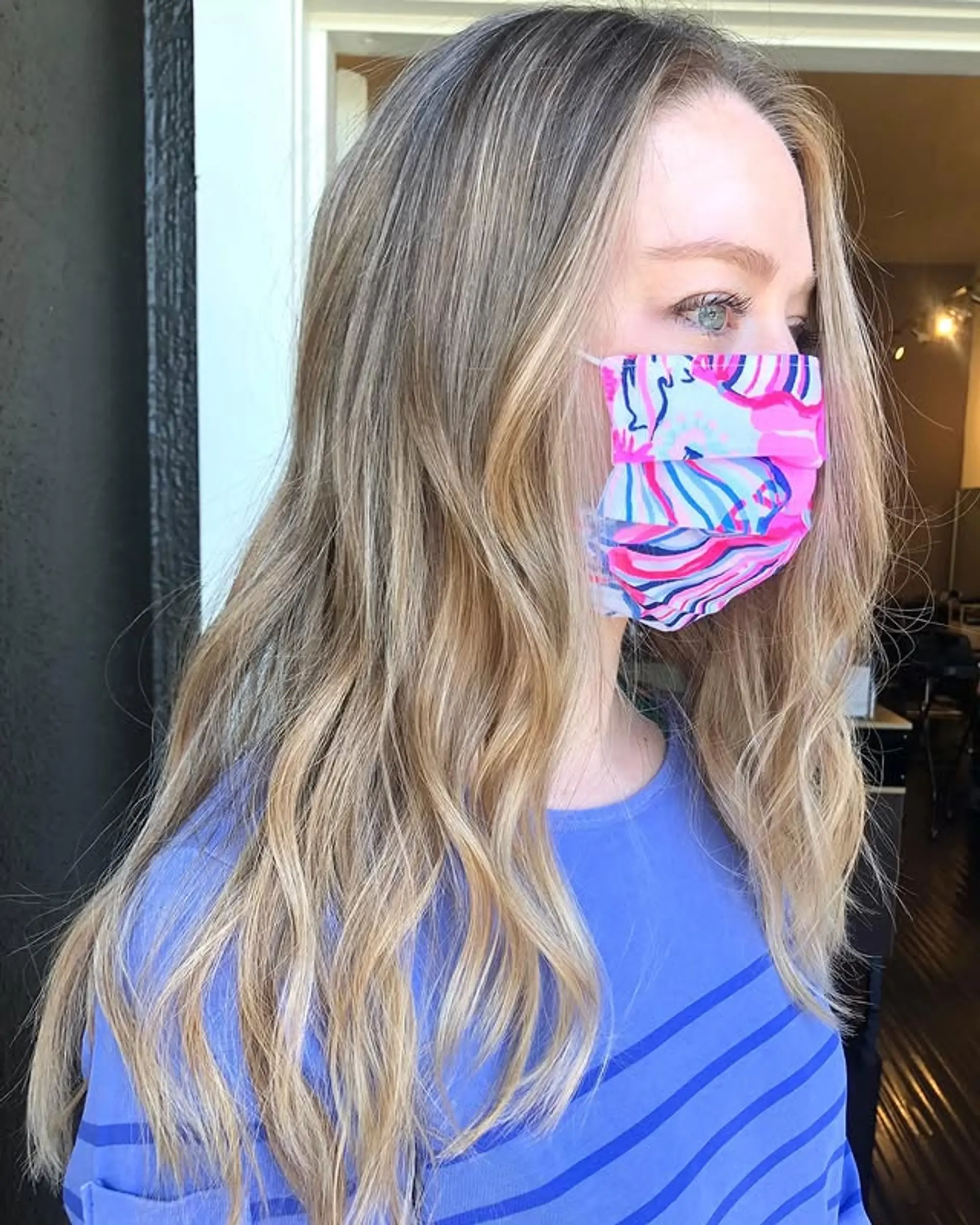 Long, wavy hair with a subtle blonde balayage. 1