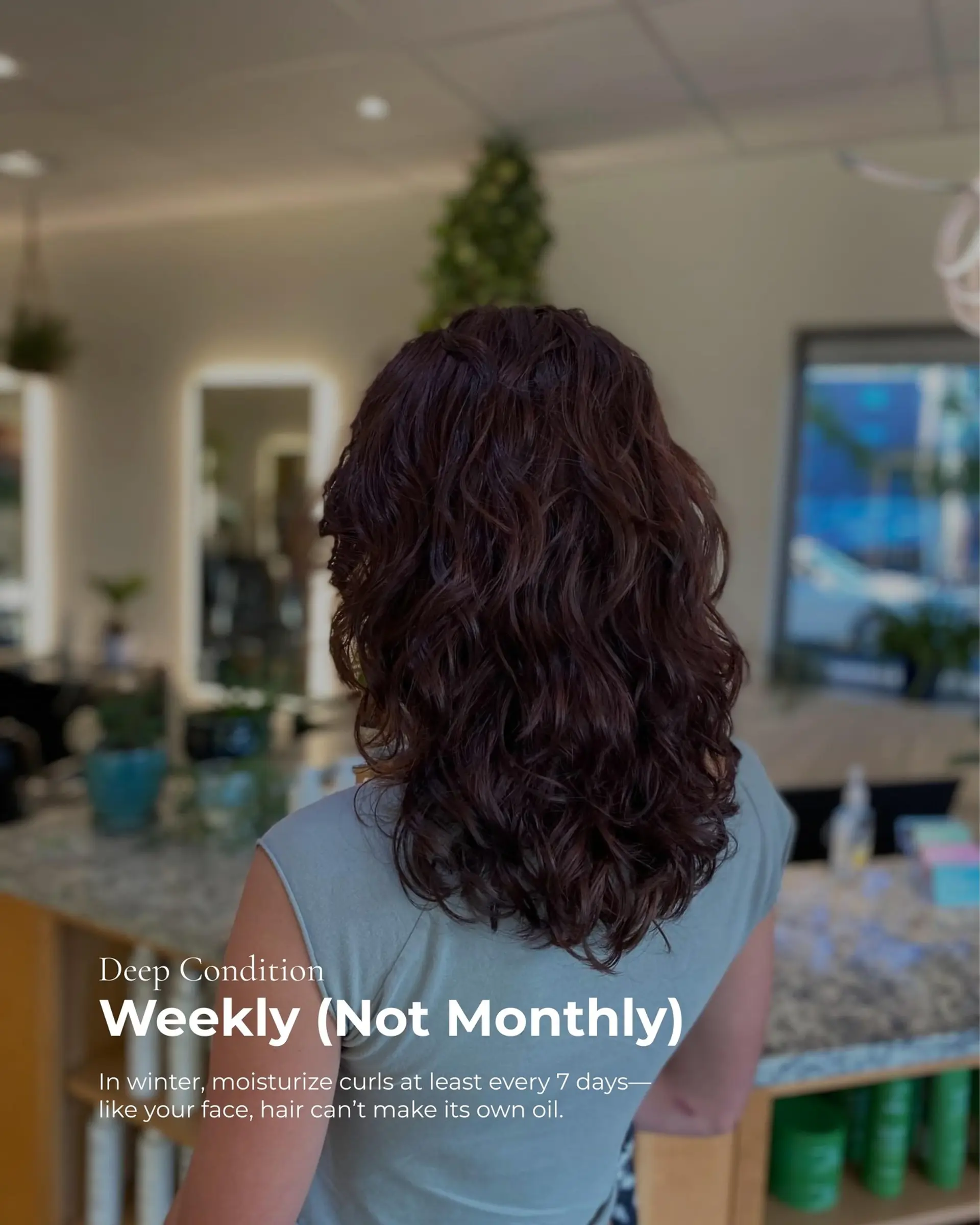 Medium-length dark brown hair cut with soft cascading layers to enhance natural wavy-curly texture and bounce. 1