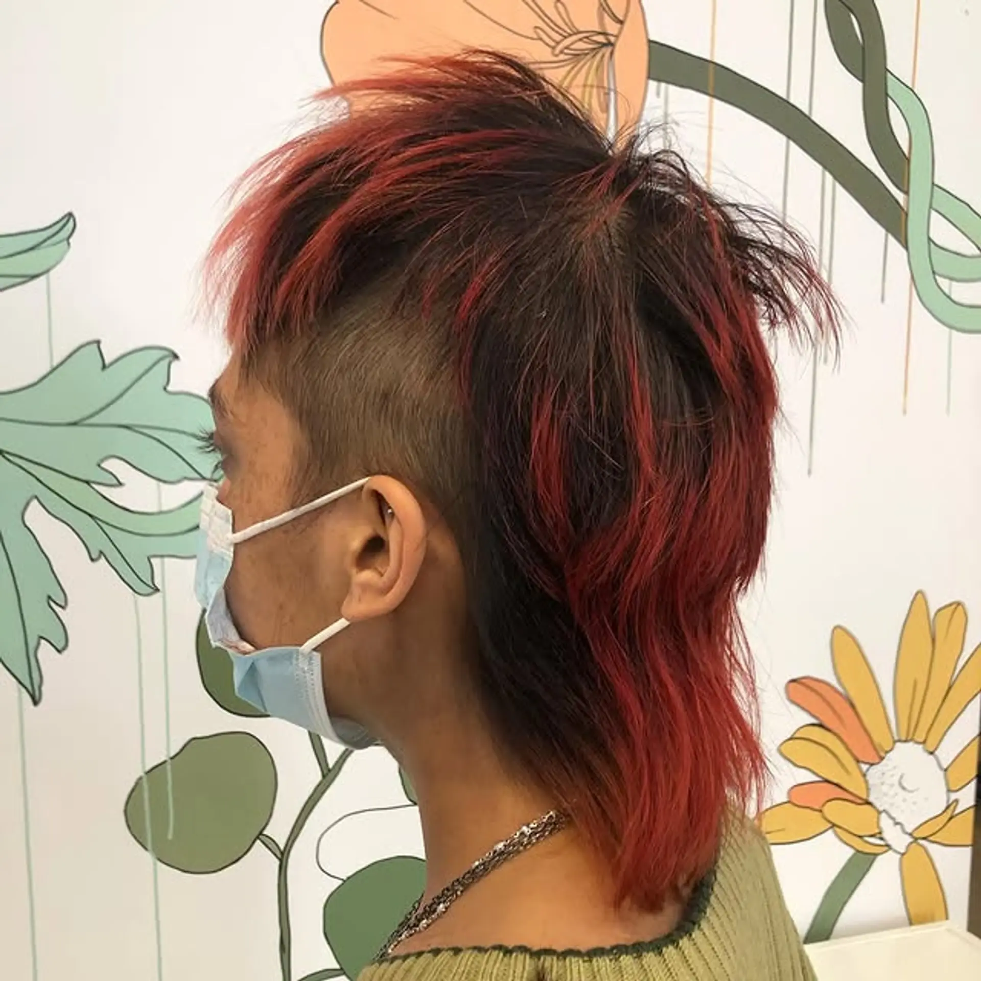 A modern take on the classic mullet, featuring an undercut and bold red highlights. 1