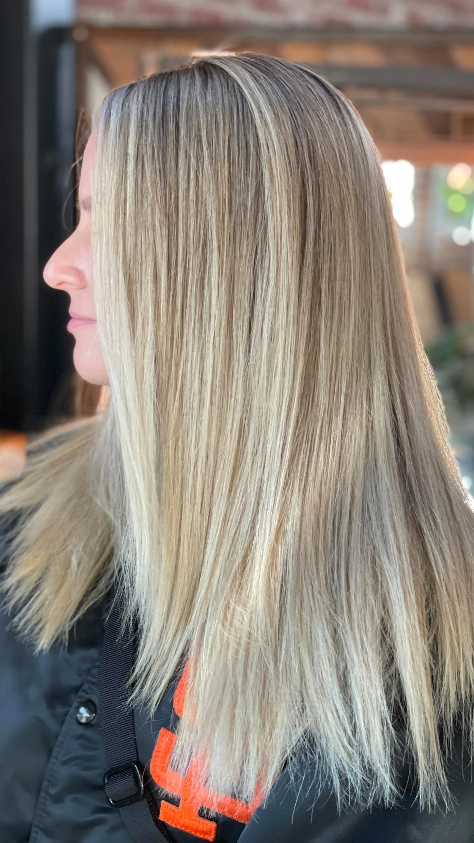 Straight long hair styled with finely blended dimensional blonde highlights. 1