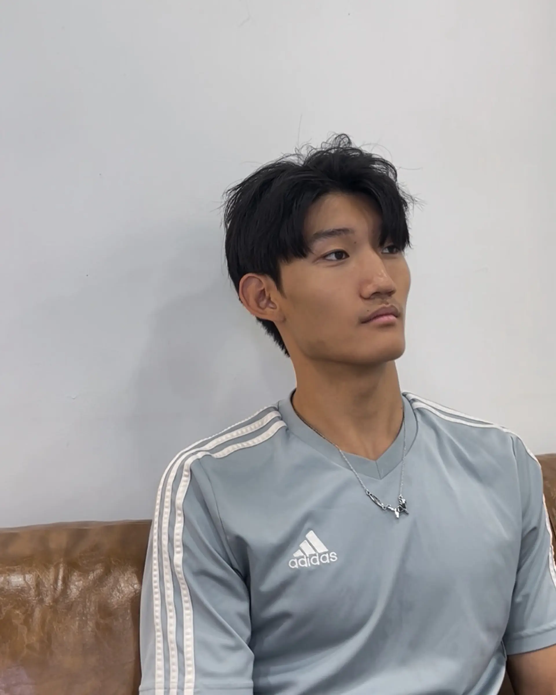 A short, textured crew cut with tapered sides for a modern, edgy look. 1