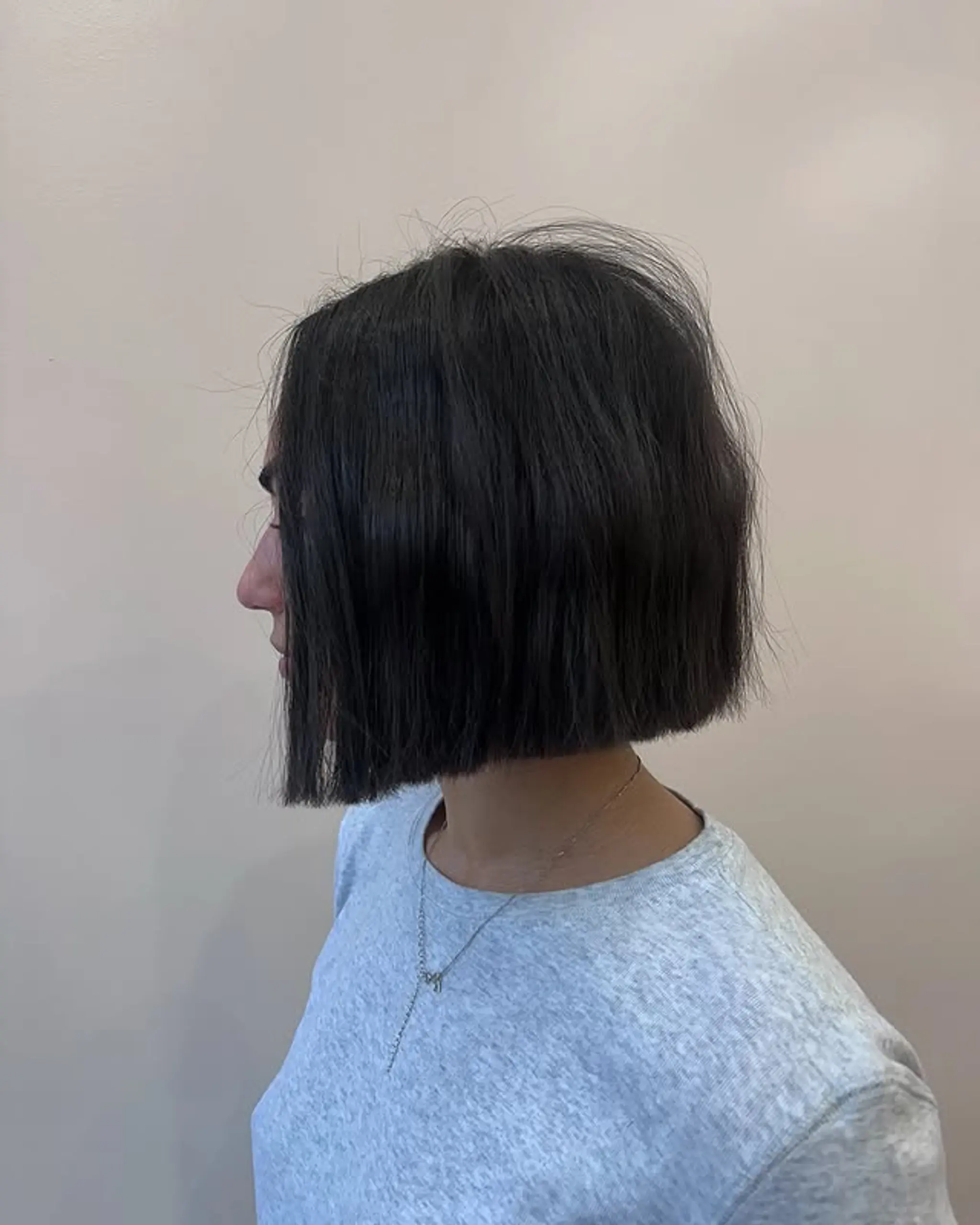A blunt, chin-length bob with a sleek finish.
