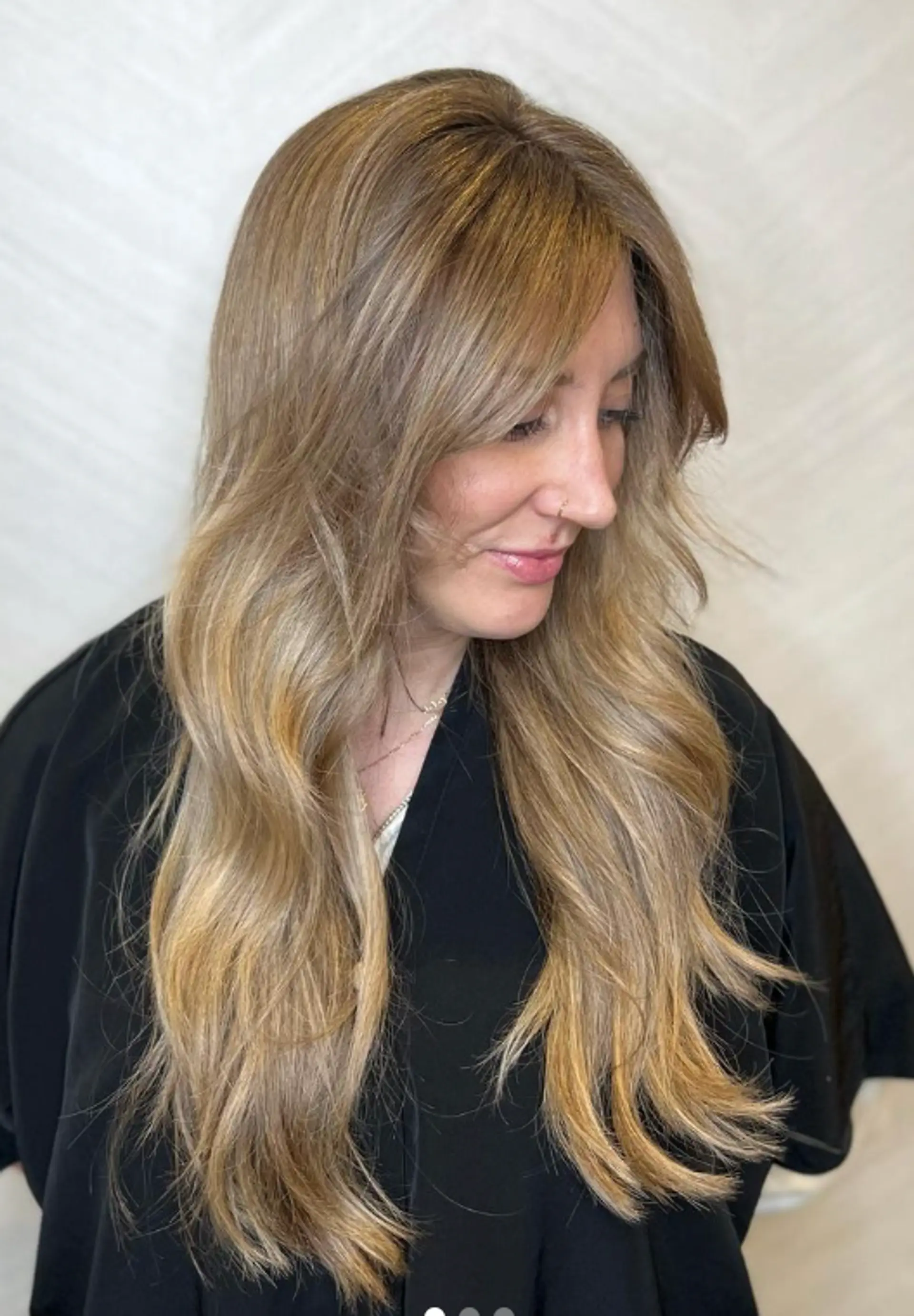 Long, wavy blonde hair with golden highlights, featuring a natural, layered flow and soft, loose waves.

Color by @simabeautynyc
Cut and style by @juliamannino_hair
 3