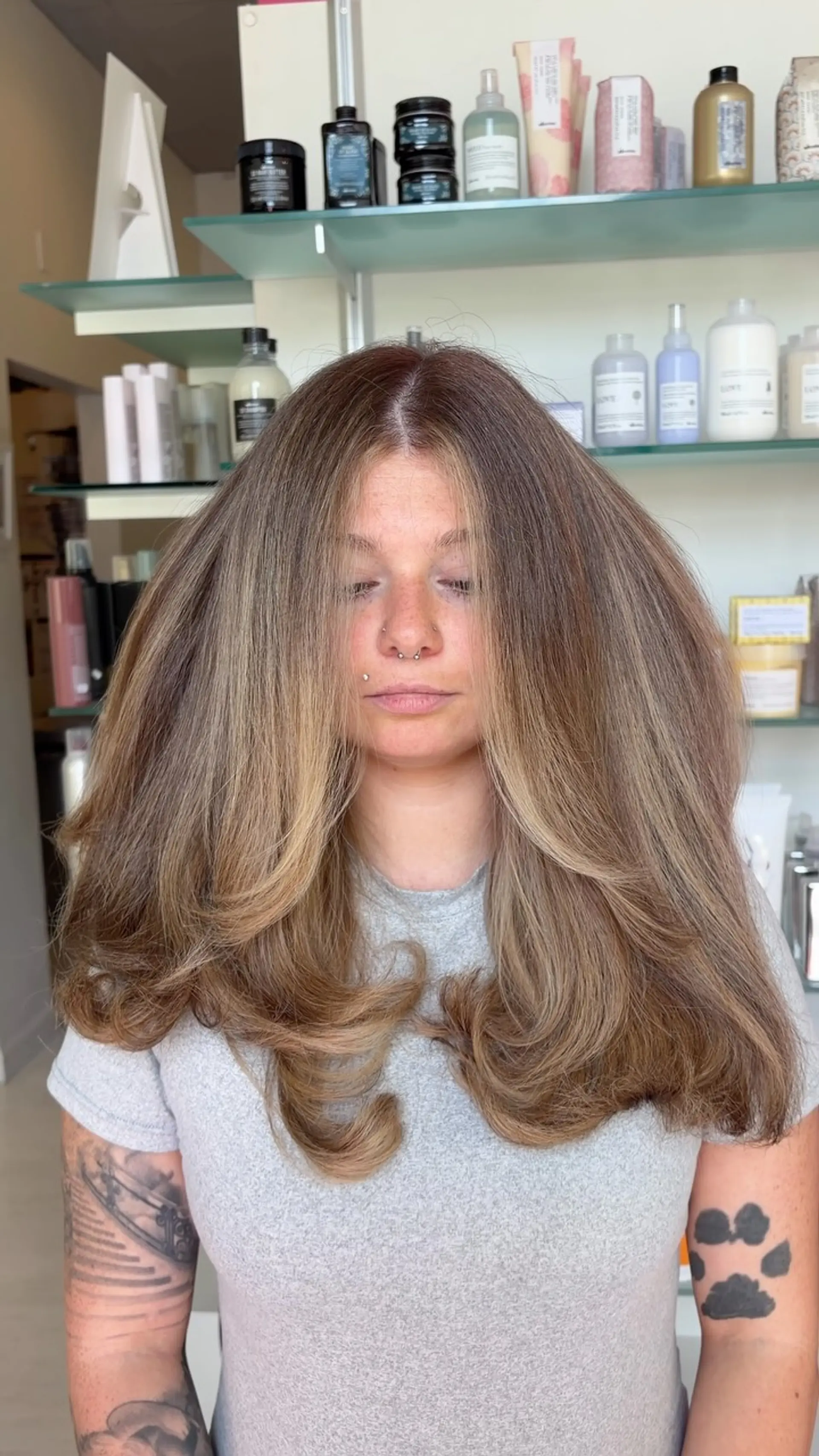 A dramatic, voluminous blowout featuring soft face-framing layers and full, rounded ends. 1