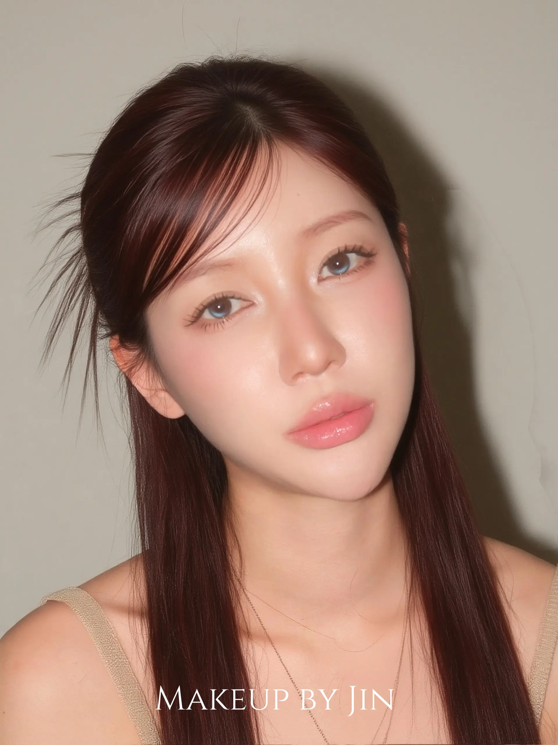 Long sleek straight auburn hair with glossy finish and soft side-swept fringe. 1
