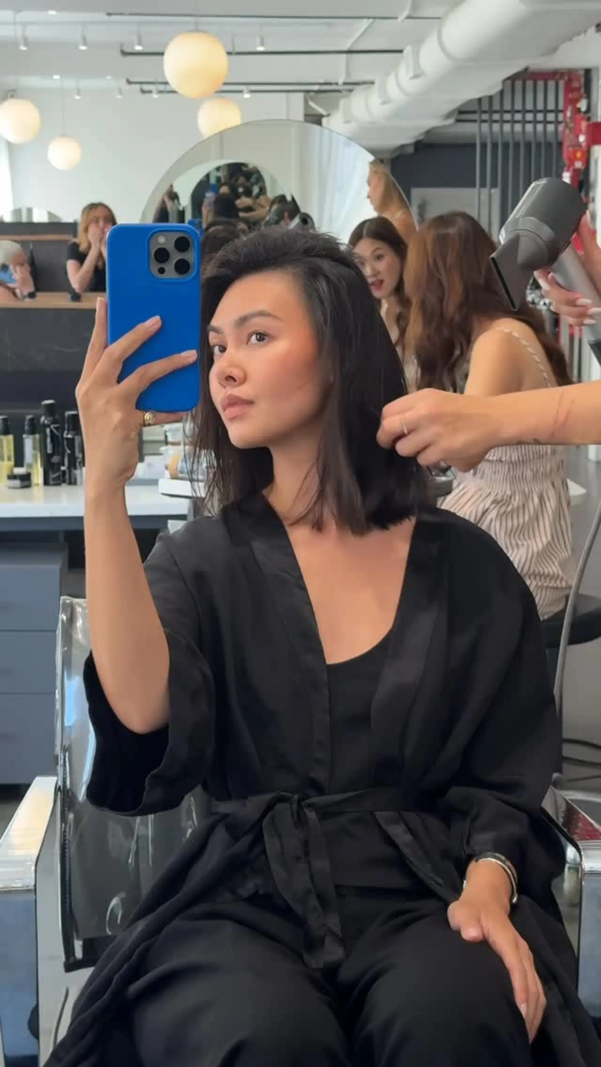 A sleek, collarbone-grazing textured lob featuring subtle neutral brown tones and soft, razored ends. 1