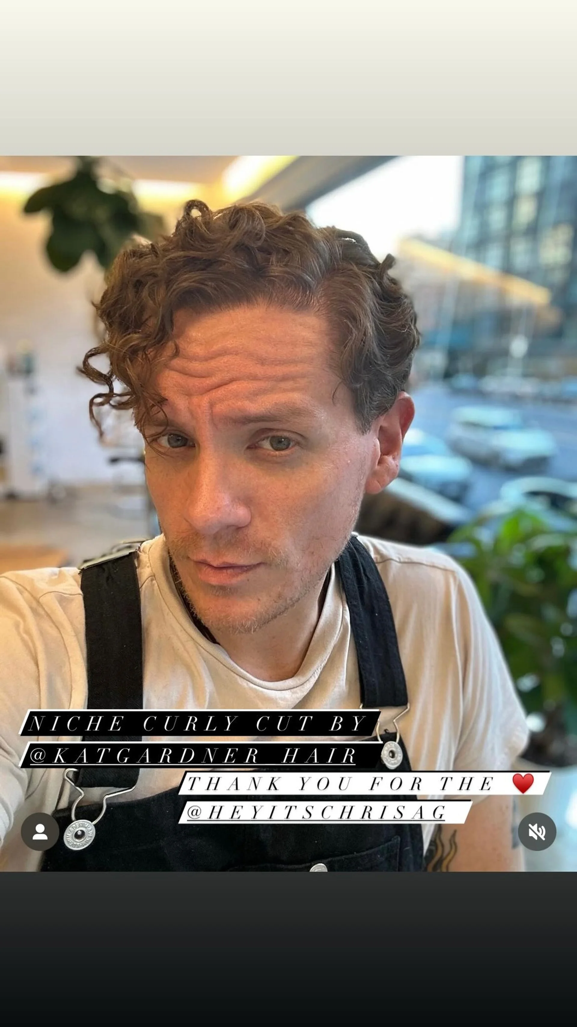 A modern men's curly haircut with a high fade and textured, voluminous curls on top. - Preview 2