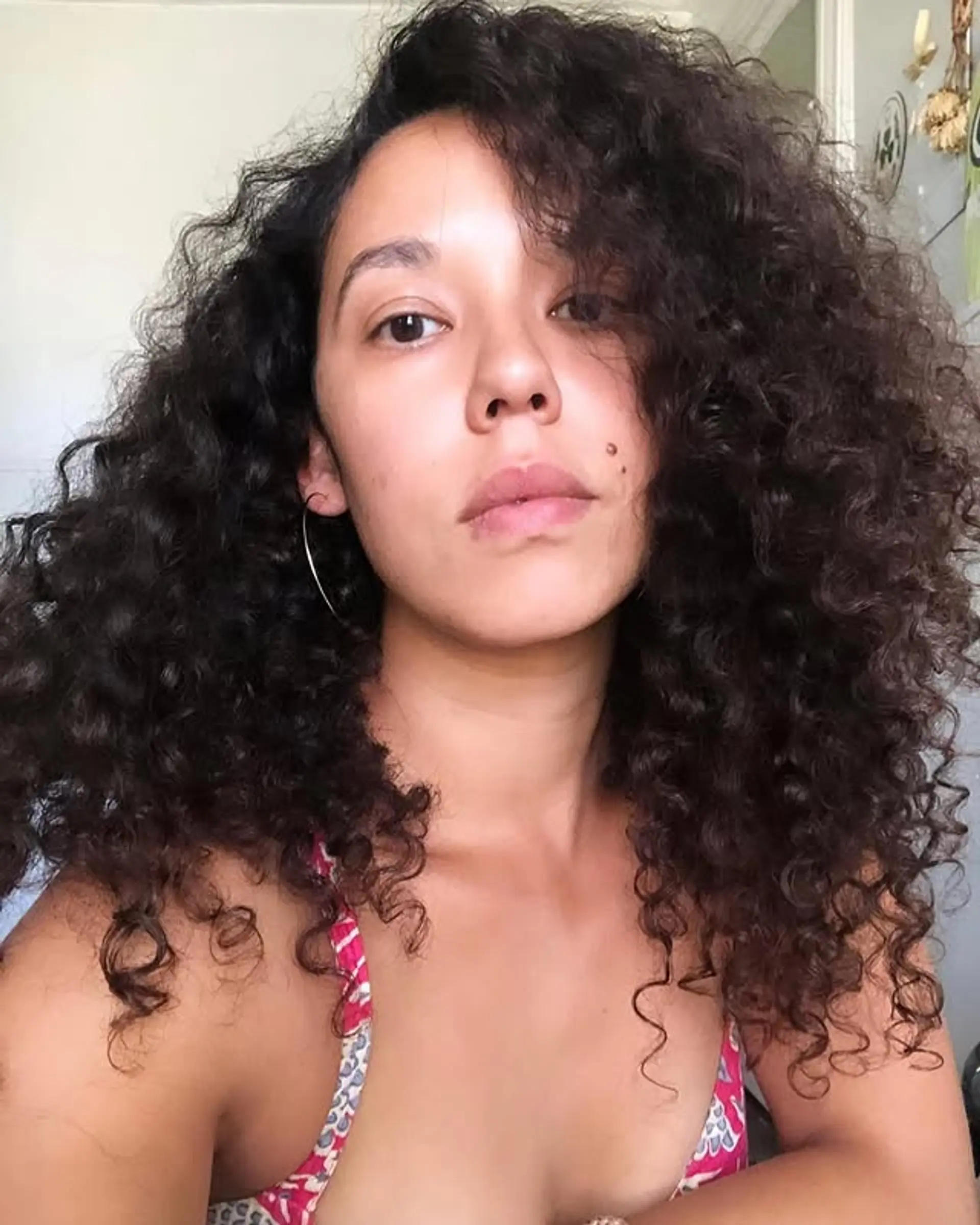 A voluminous curly afro with natural-looking curls. 1