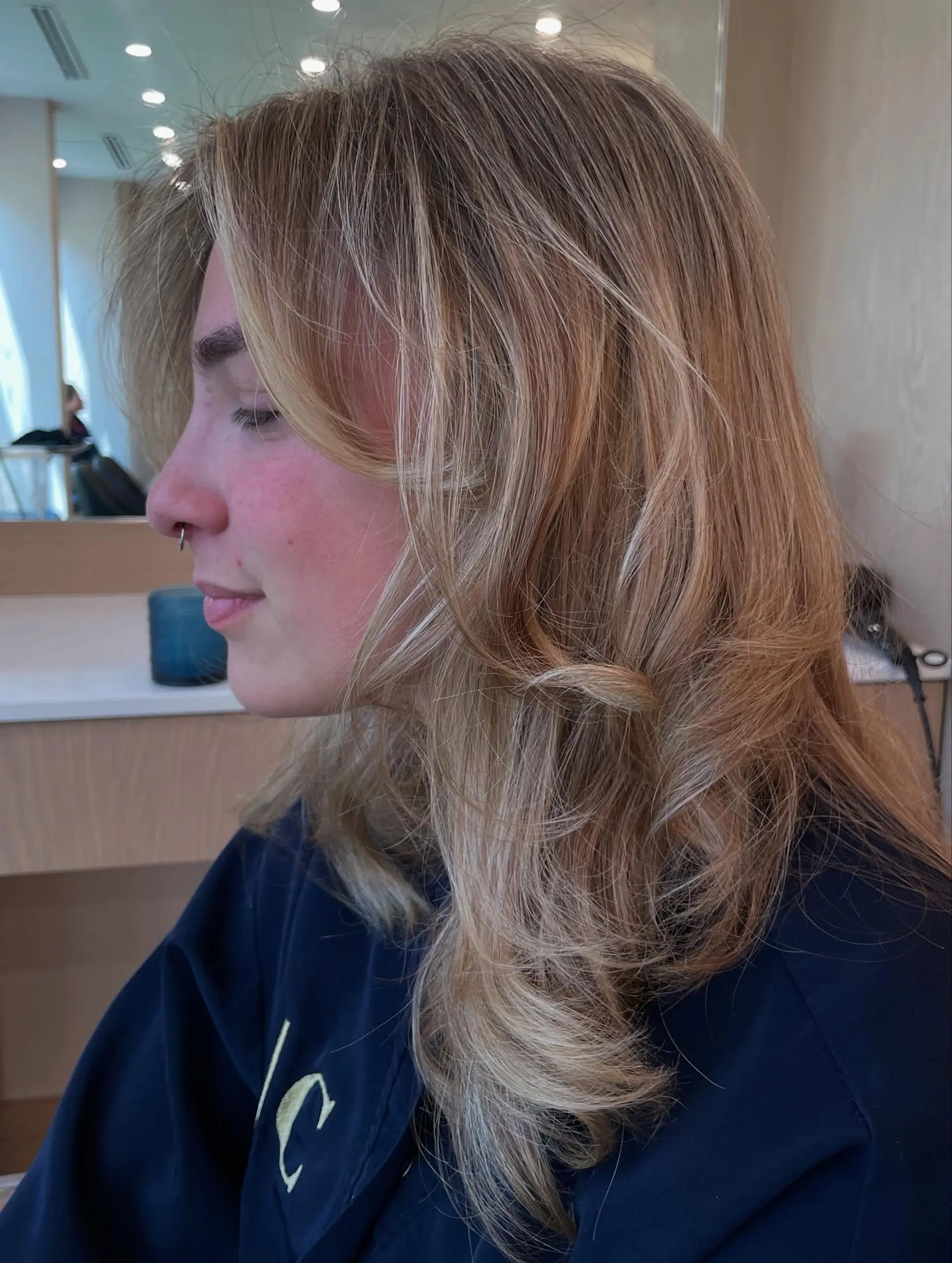 A medium-length shag haircut with curtain bangs and textured layers. 3