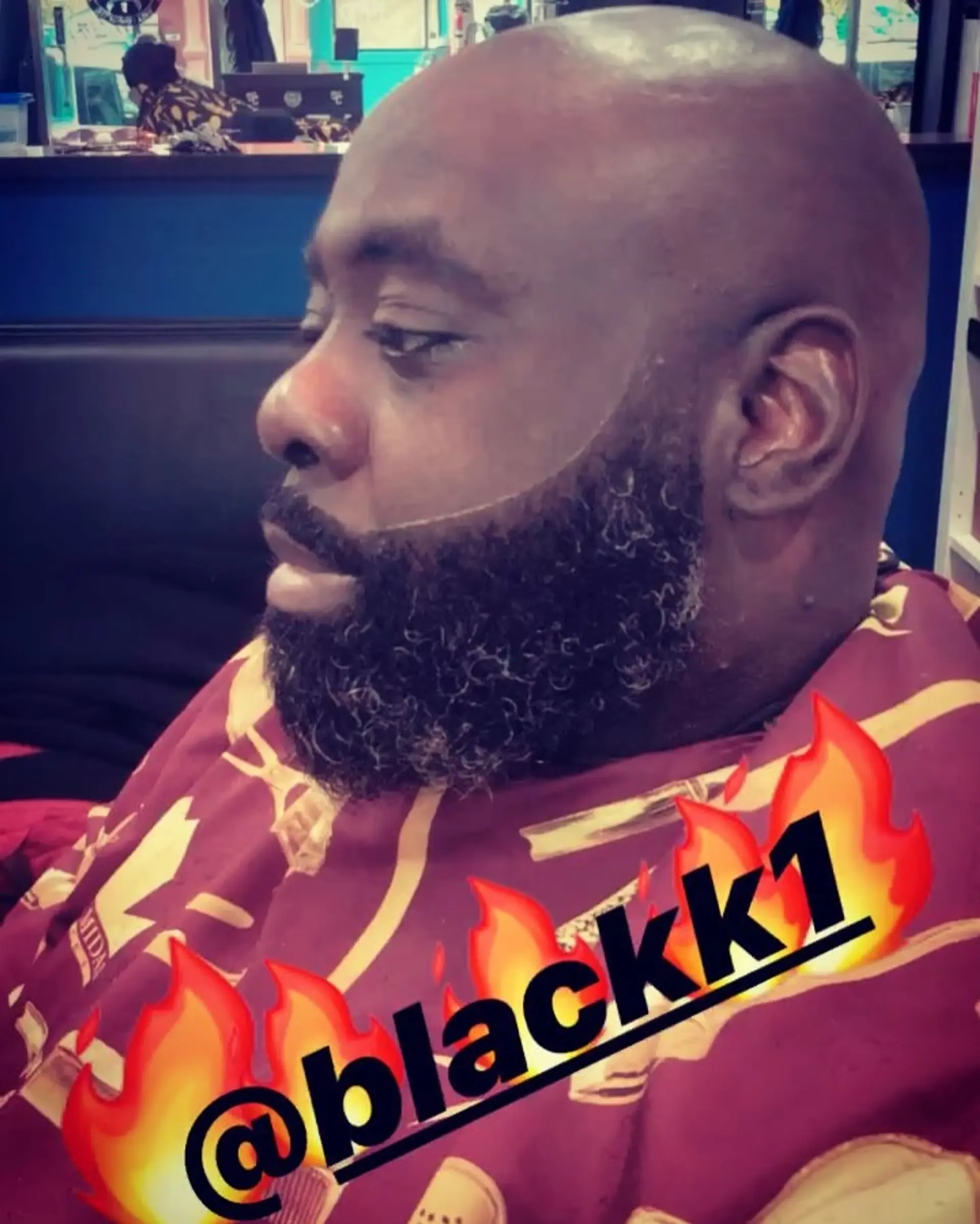 Clean bald head paired with a neatly sculpted full beard featuring a sharp lineup. 1