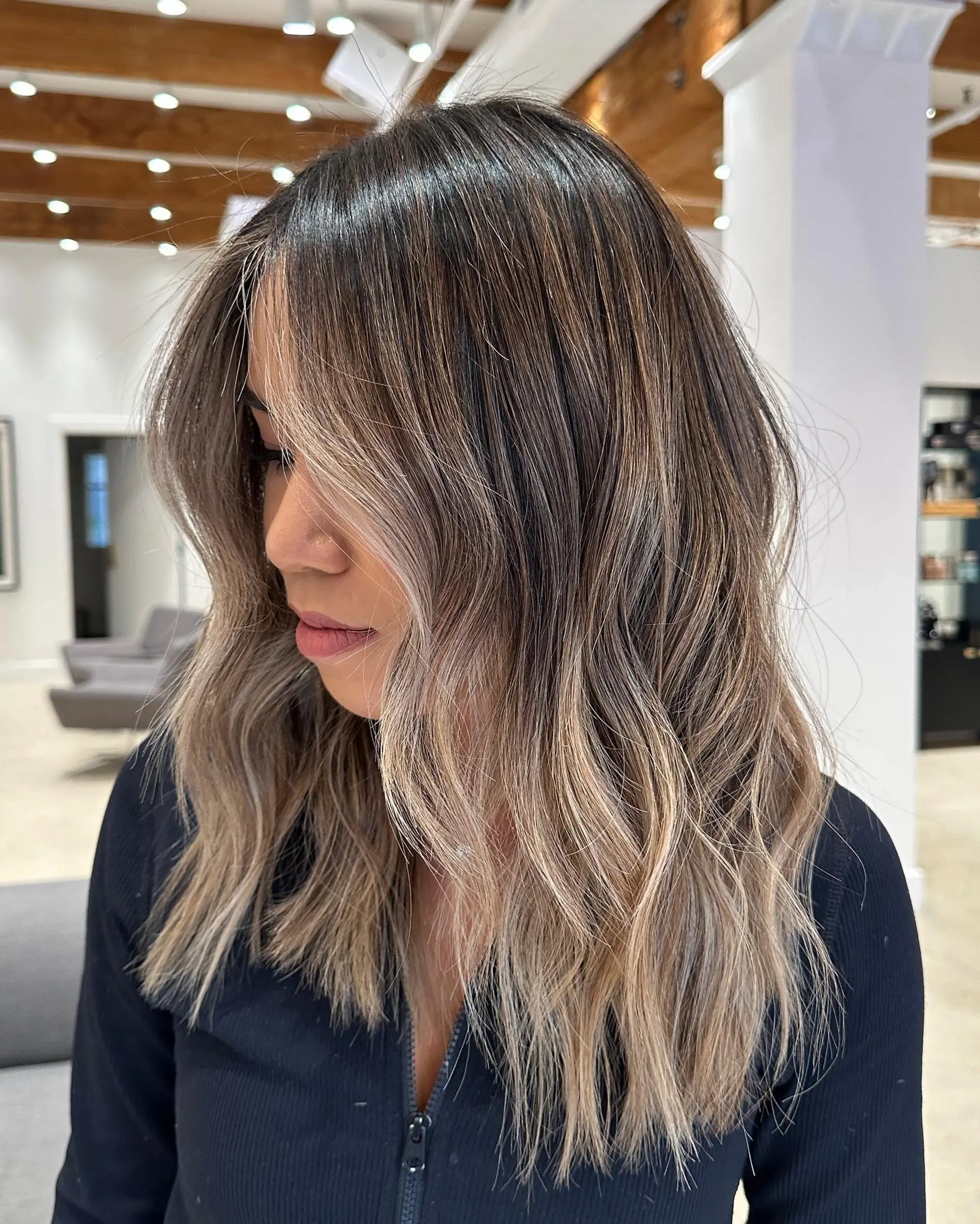 Bronde beach waves with a subtle shadow root for a natural, sun-kissed look. 1