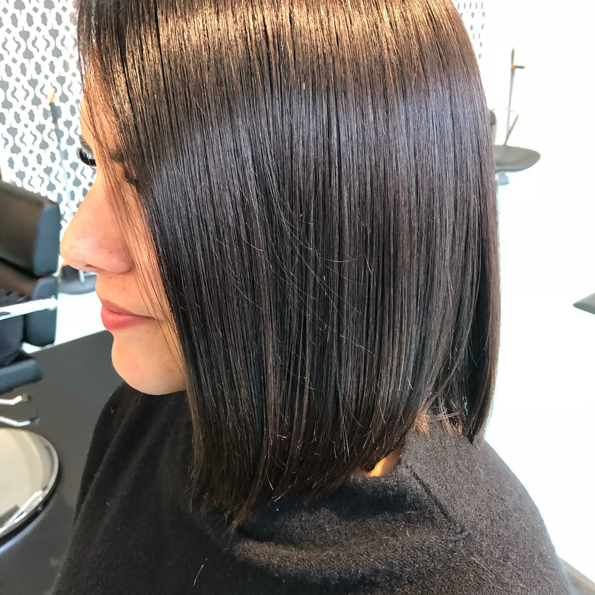 A sleek, shoulder-grazing blunt lob cut in a rich, glossy chocolate brown tone. 1