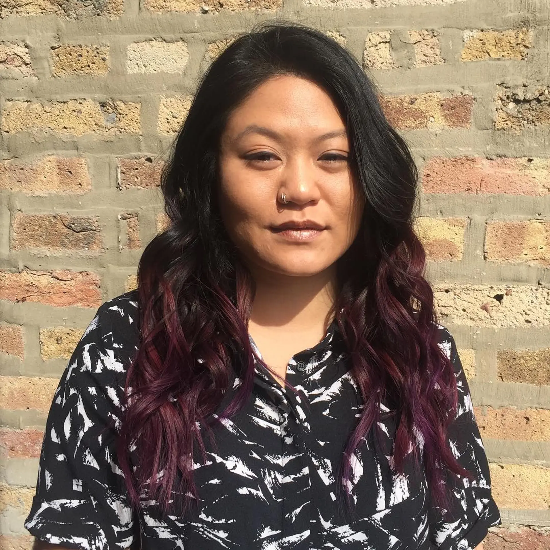 Long, wavy hair with a bold burgundy ombre effect. 1