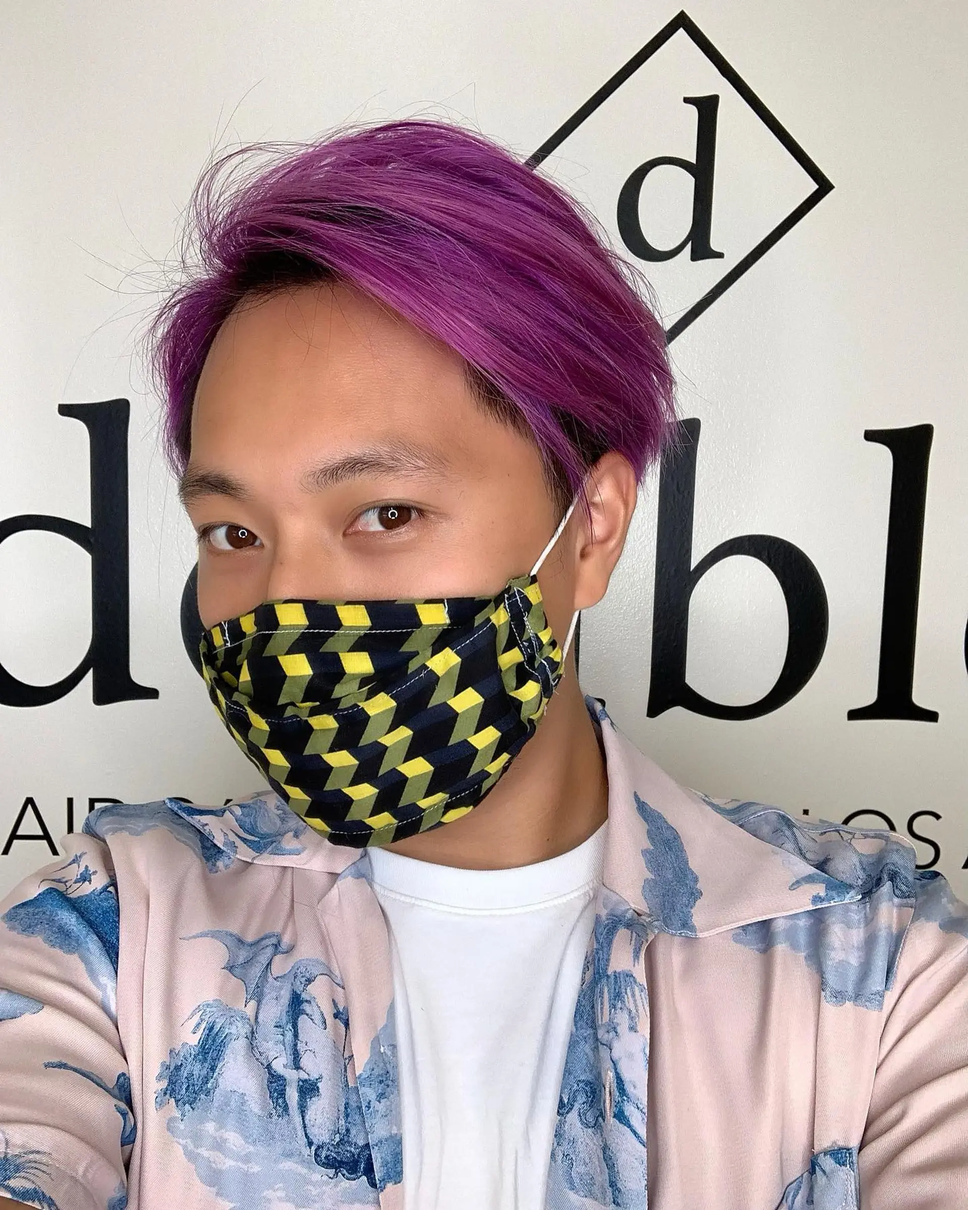 Short straight hair styled with a side part and swept-over volume, dyed in a vibrant lavender-purple tone. 1