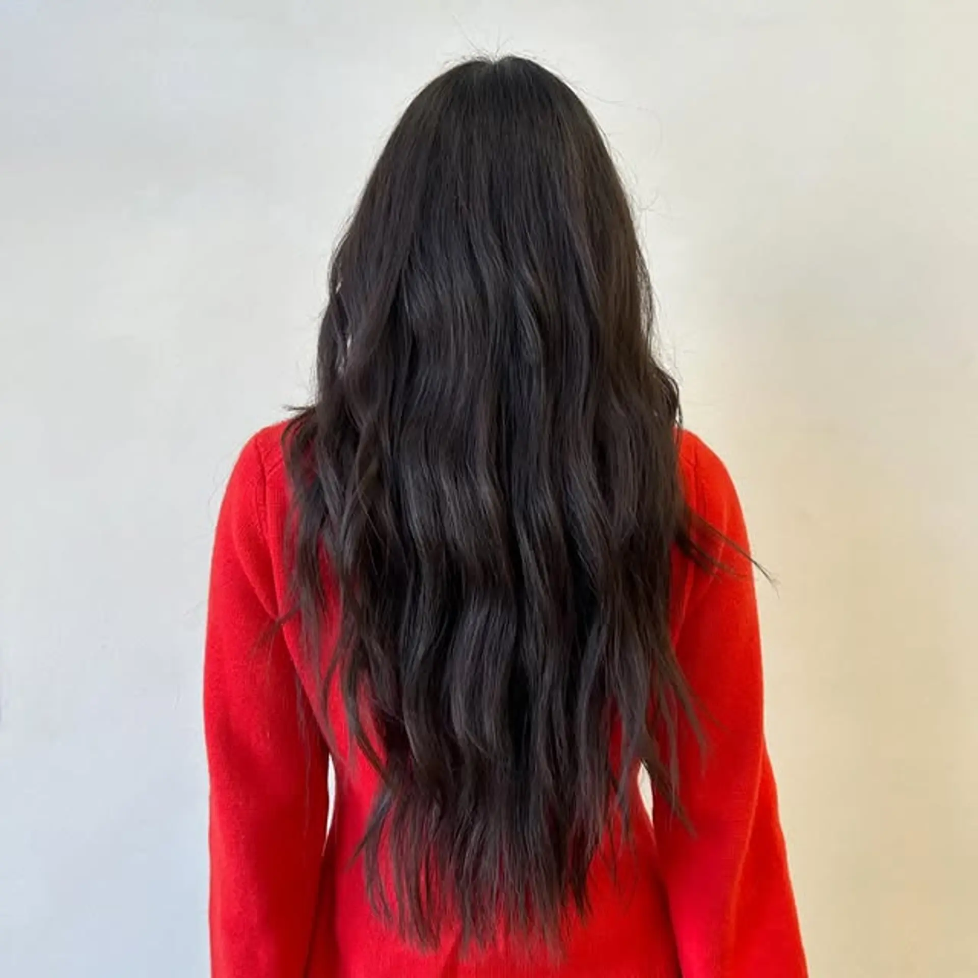 Long wavy hairstyle with subtle layers for added movement and volume. 1
