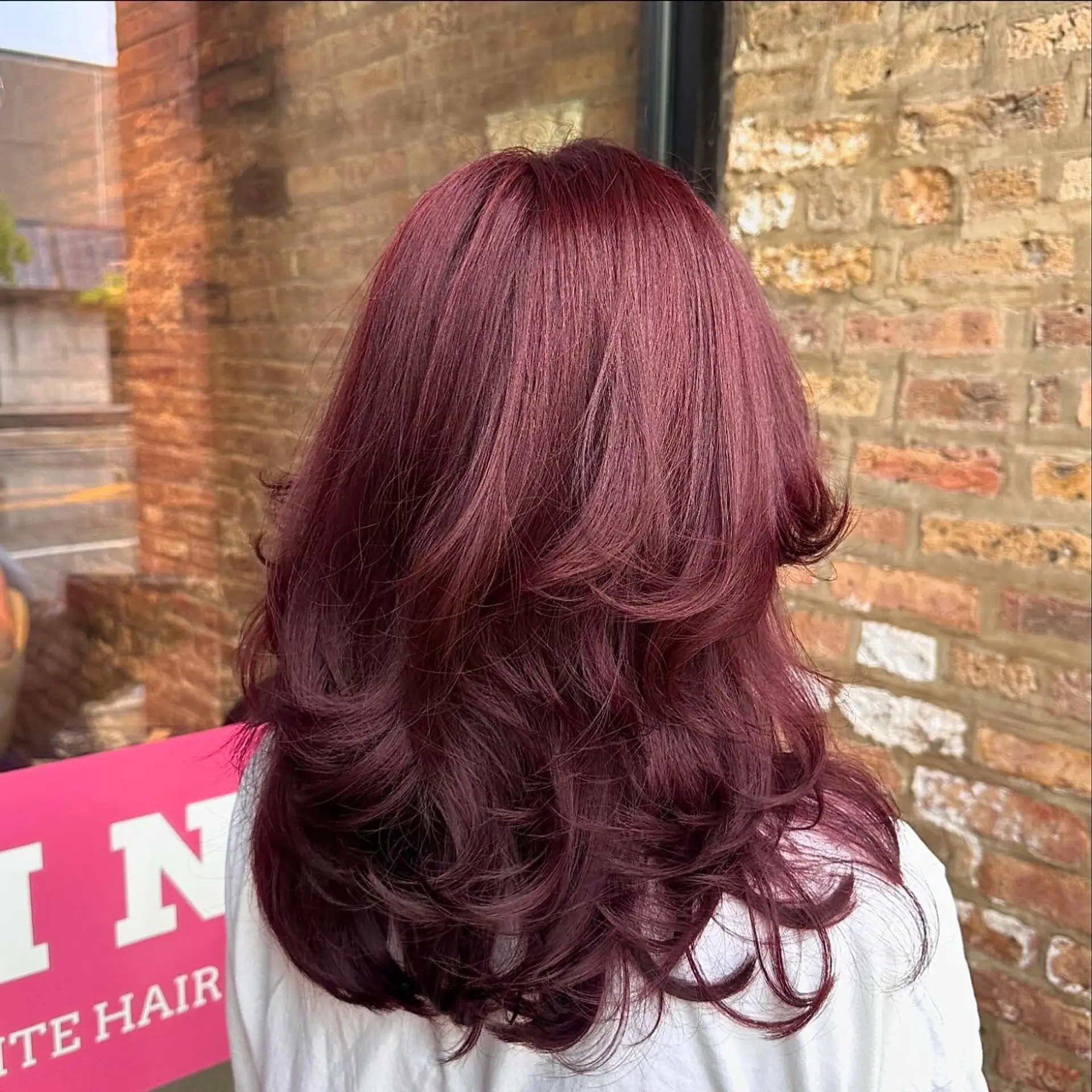 A long, wavy hairstyle with layers to create volume and movement. 1