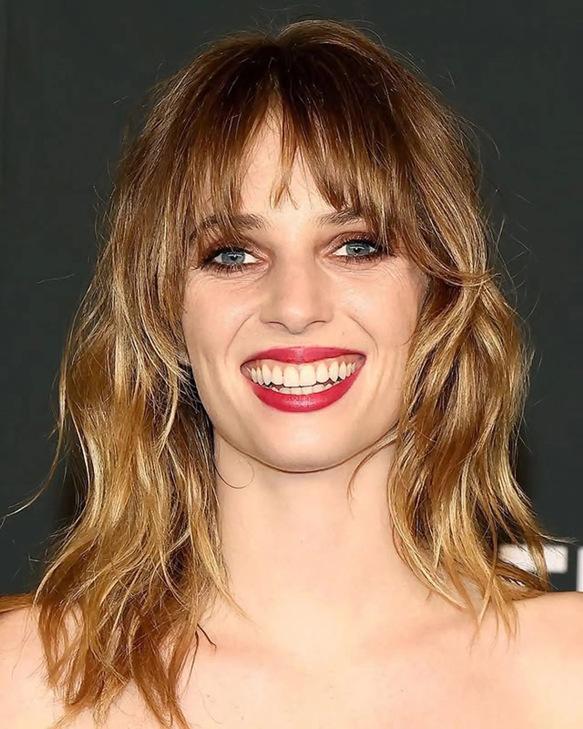 A wavy shag haircut with fringe bangs and layers. 1