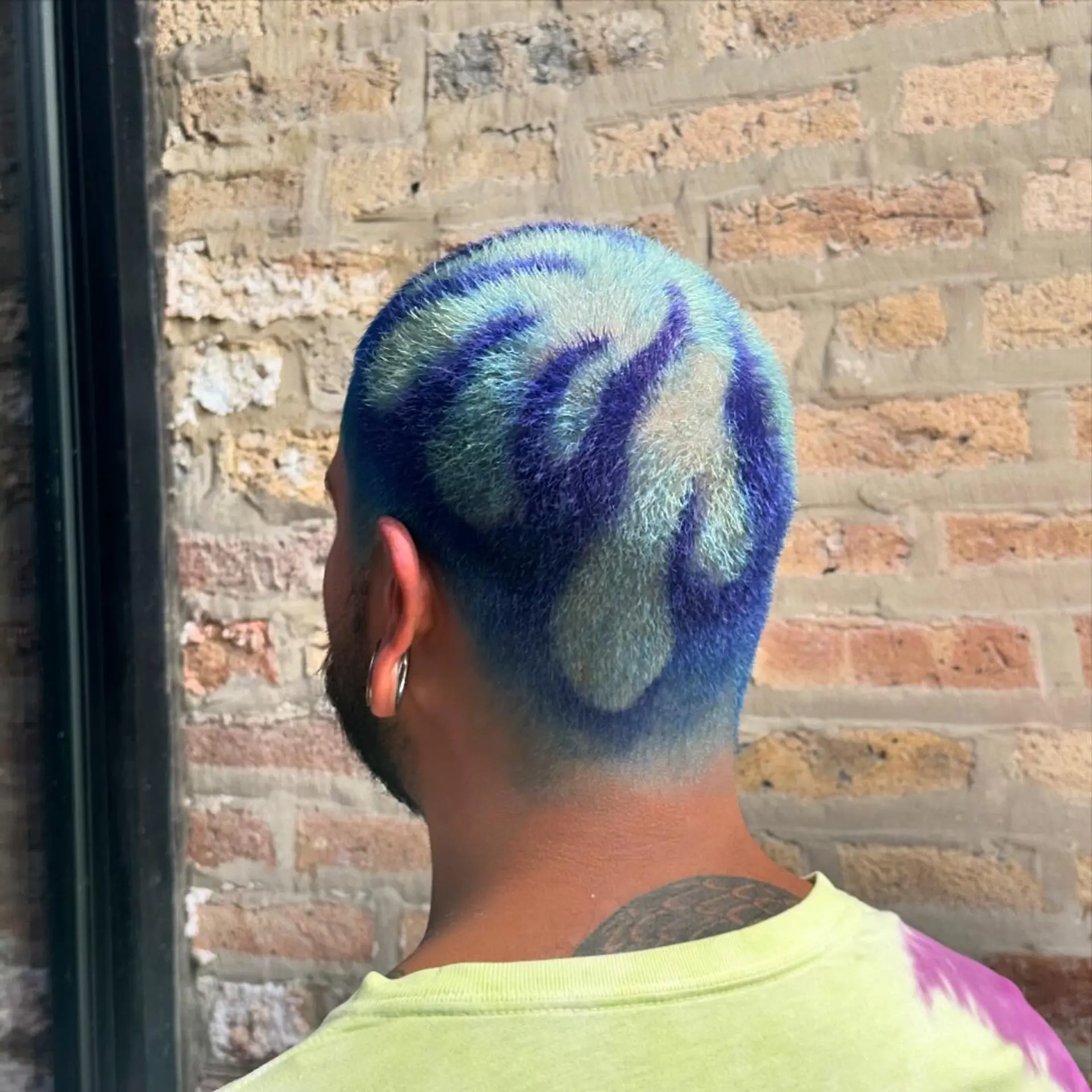 A very short buzzcut with a unique floral design. 3