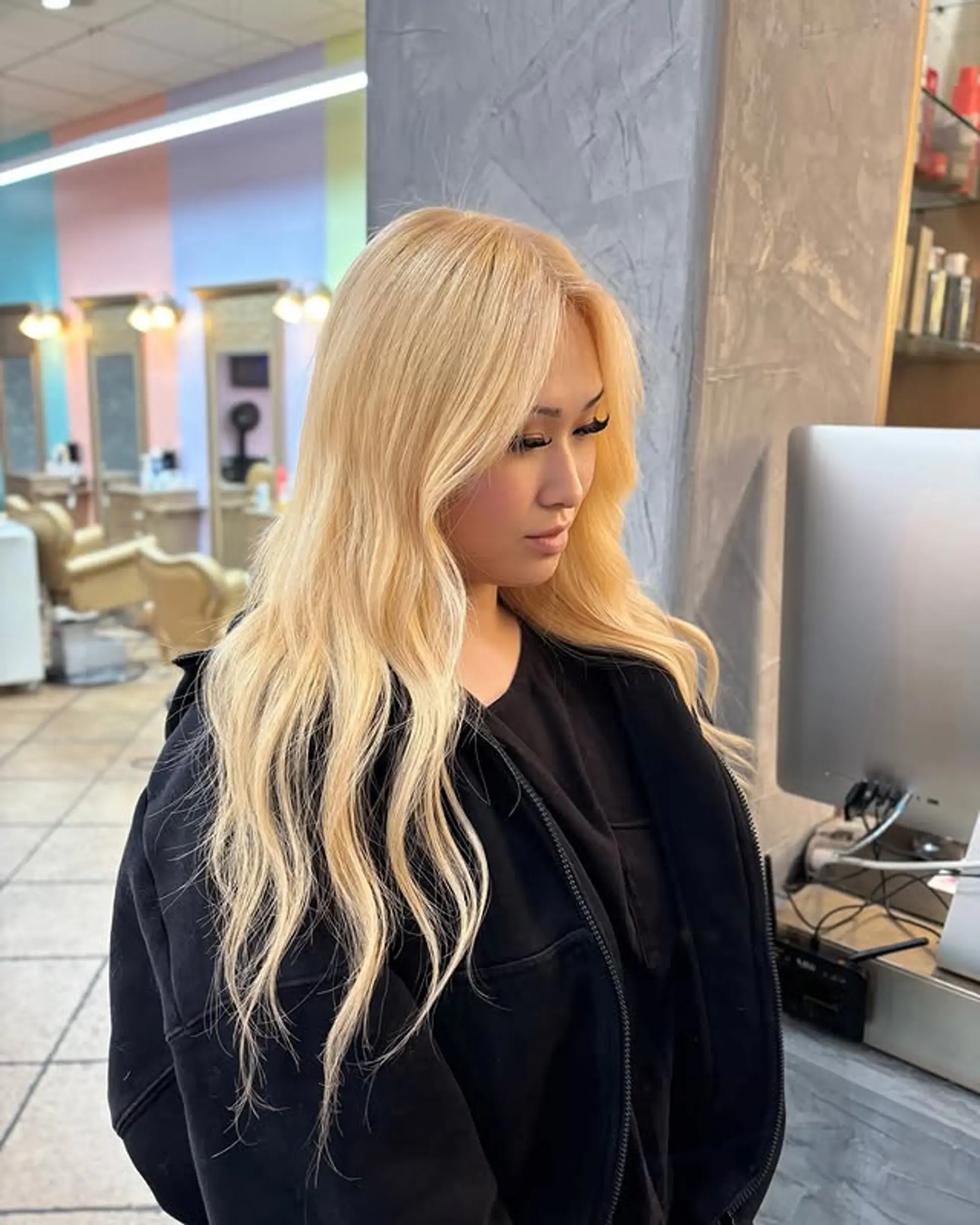 Long, wavy hair styled into loose beach waves. 1