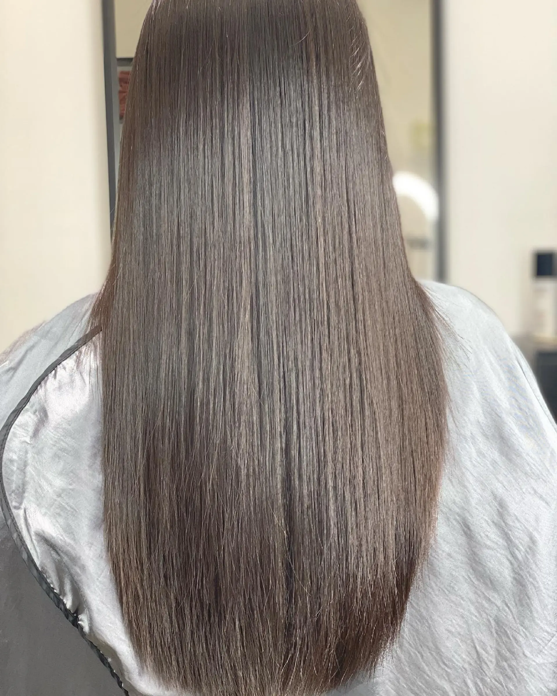 Long, straight hair with a sleek and glossy finish. 1