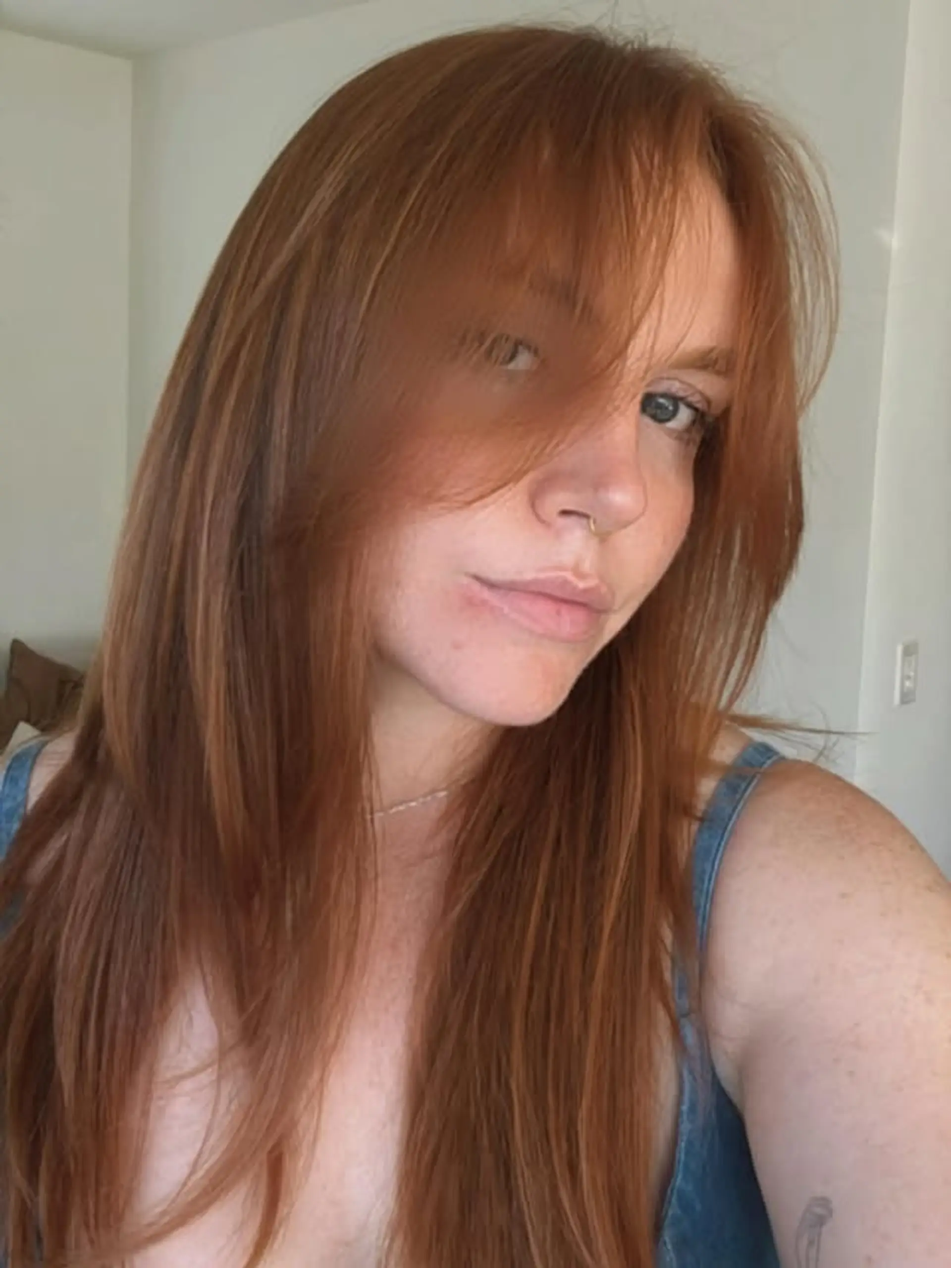 Long layered haircut with face-framing layers and bangs. 1