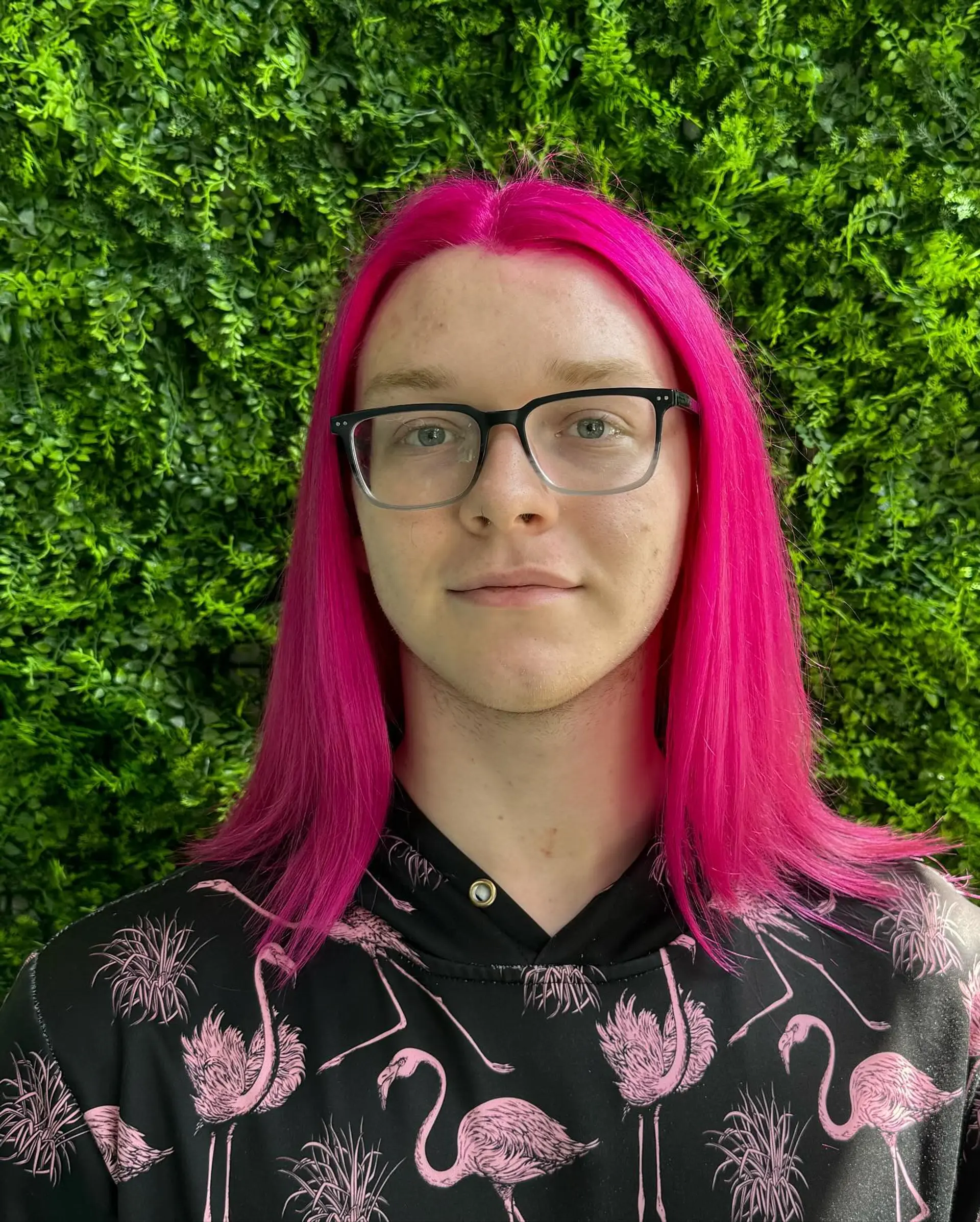 Long, straight hair dyed a vibrant hot pink. 1