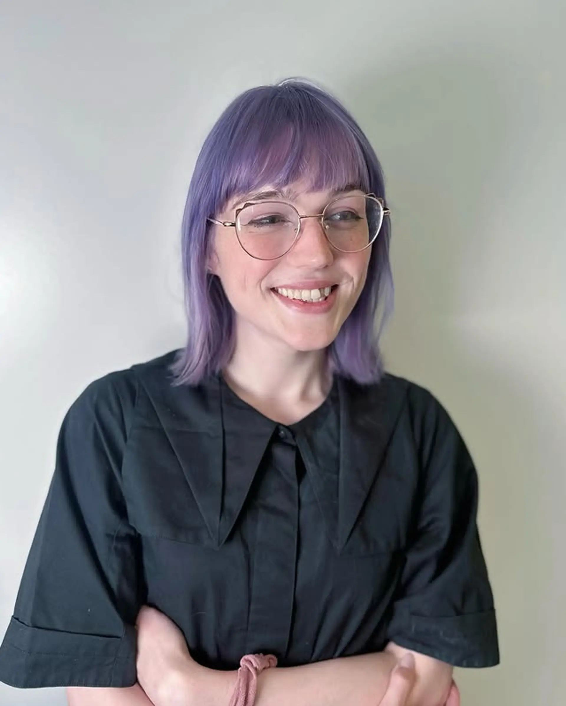 A shoulder-length bob with blunt bangs and a pastel purple color. 1
