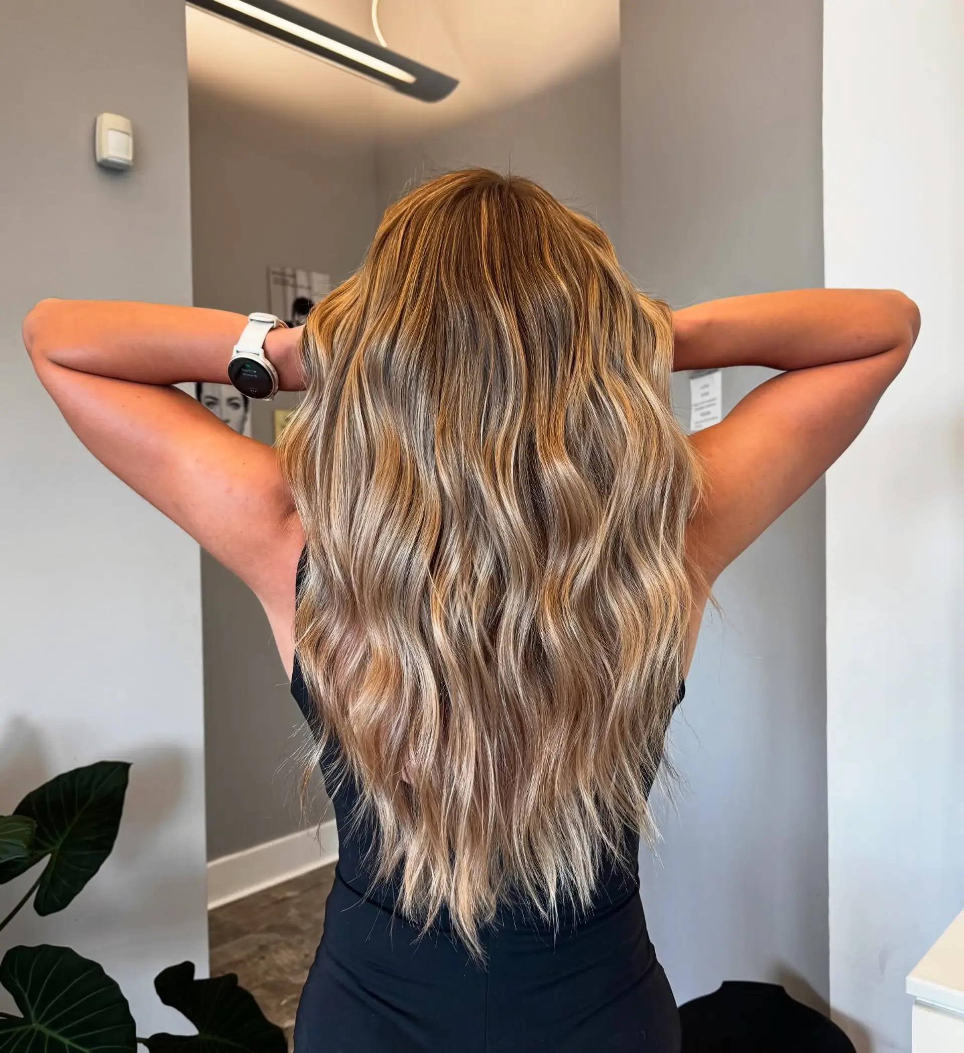 Long, wavy hair with a golden blonde balayage. 1