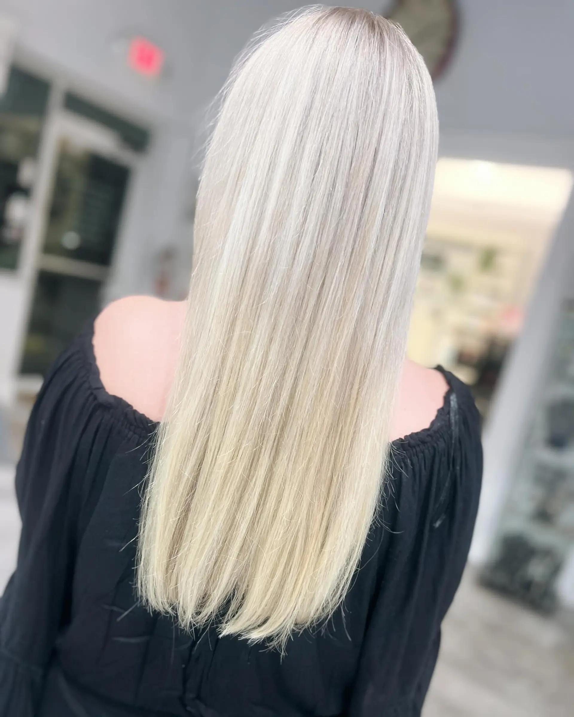 Long, straight, platinum blonde hair with a sleek finish. 1