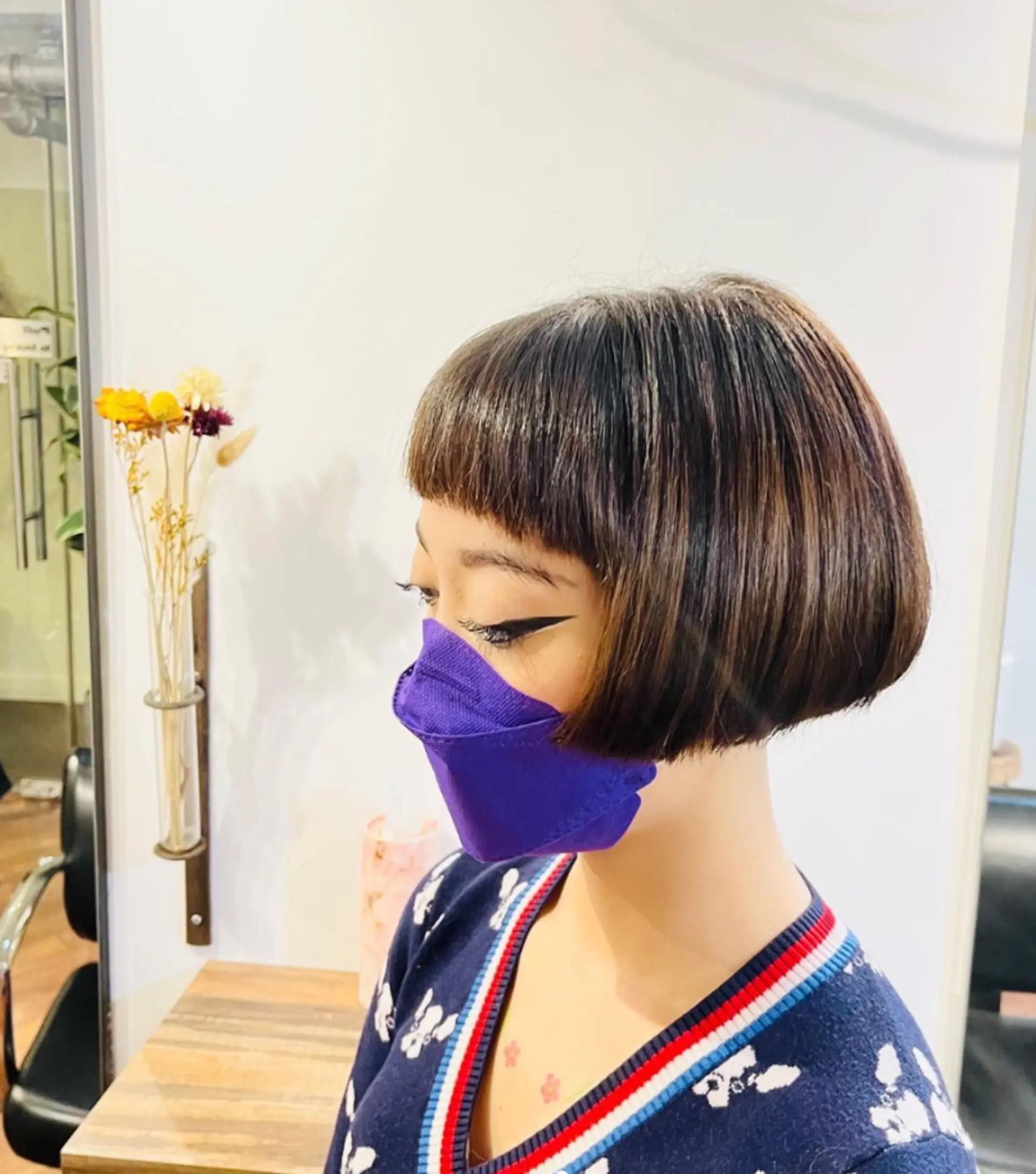 A chic blunt bob with short, straight baby bangs. 1