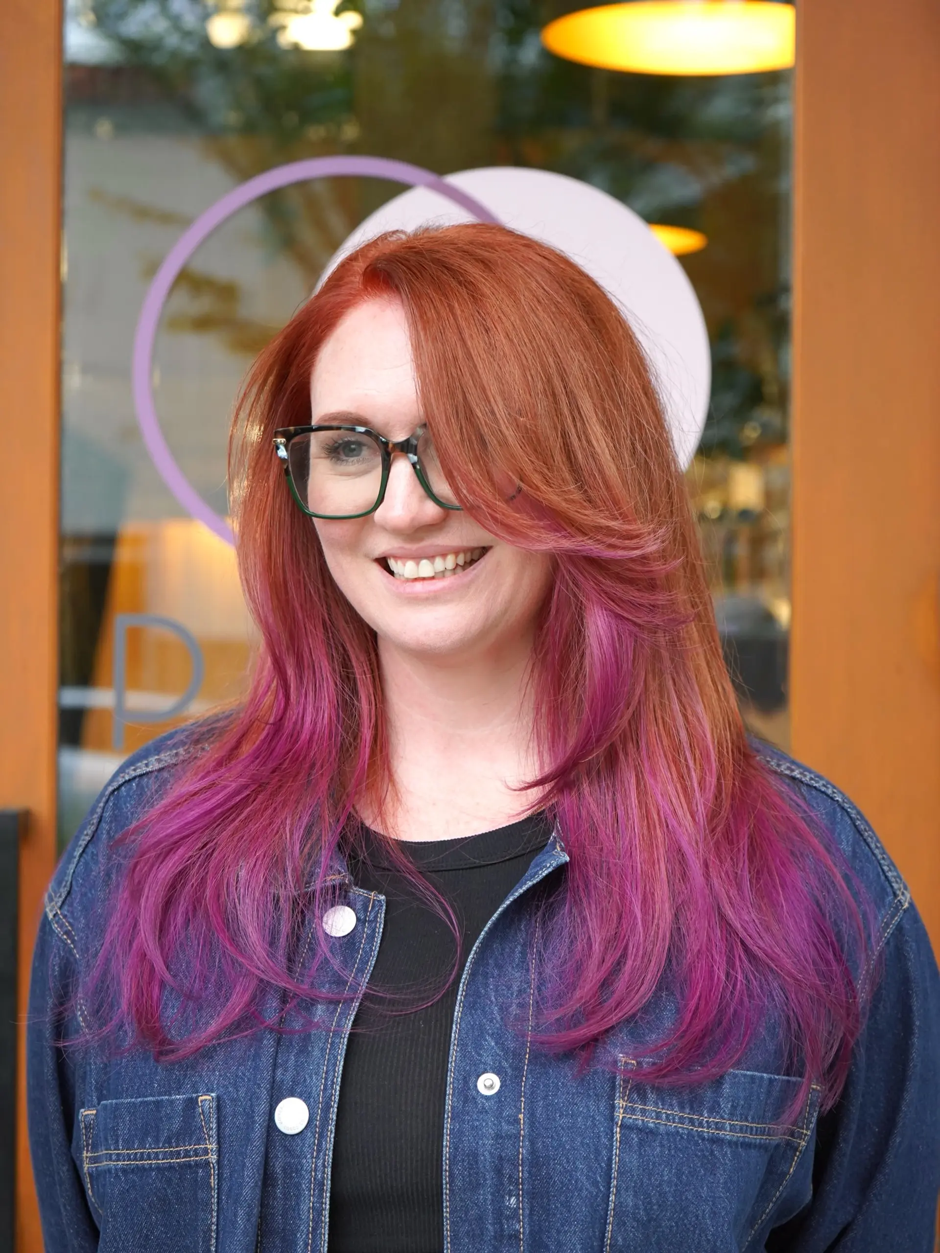 Long layered haircut with side-swept bangs, featuring a rich copper base that melts into vibrant purple ends. 1