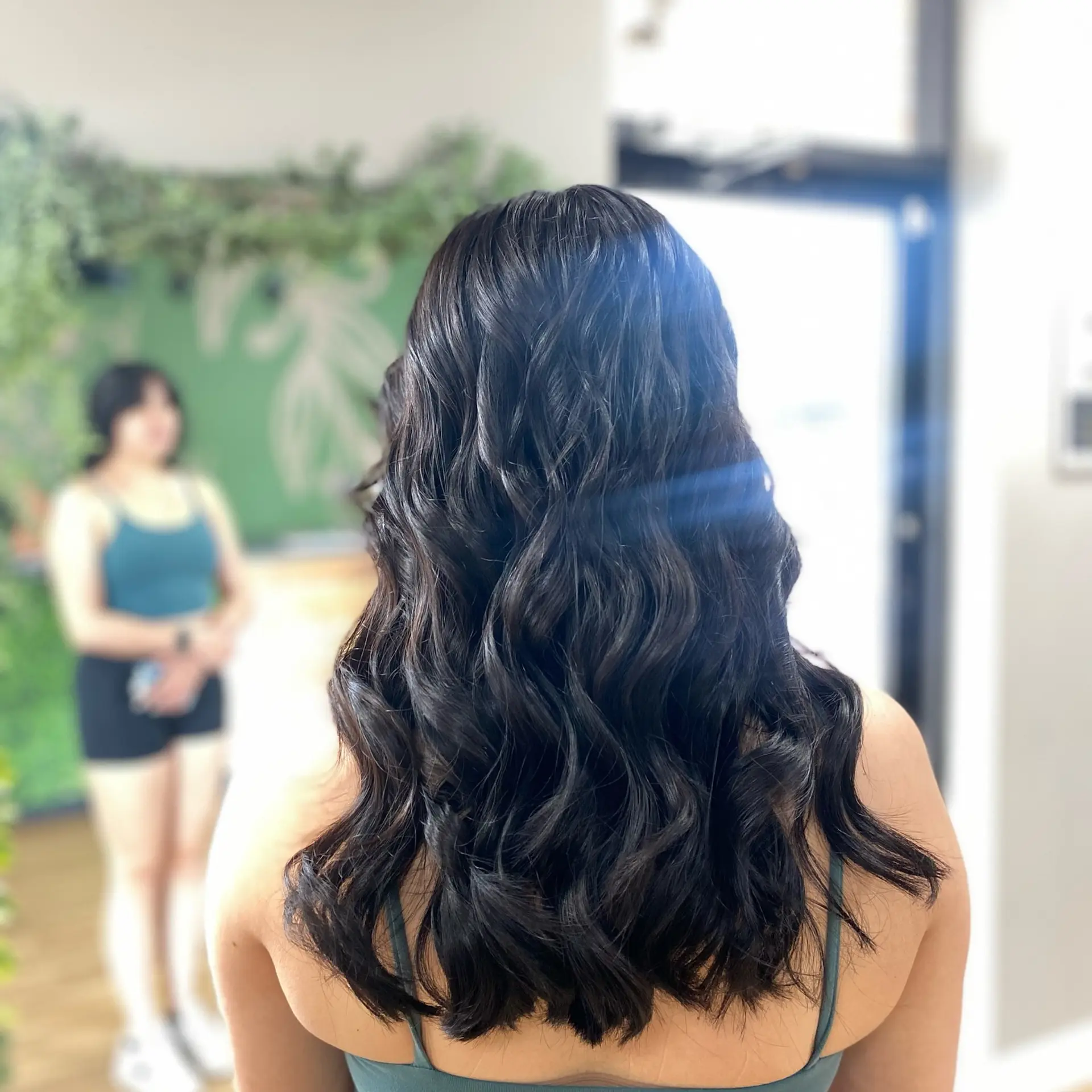 Glossy, dark brown long hair styled into loose, flowing waves. 1