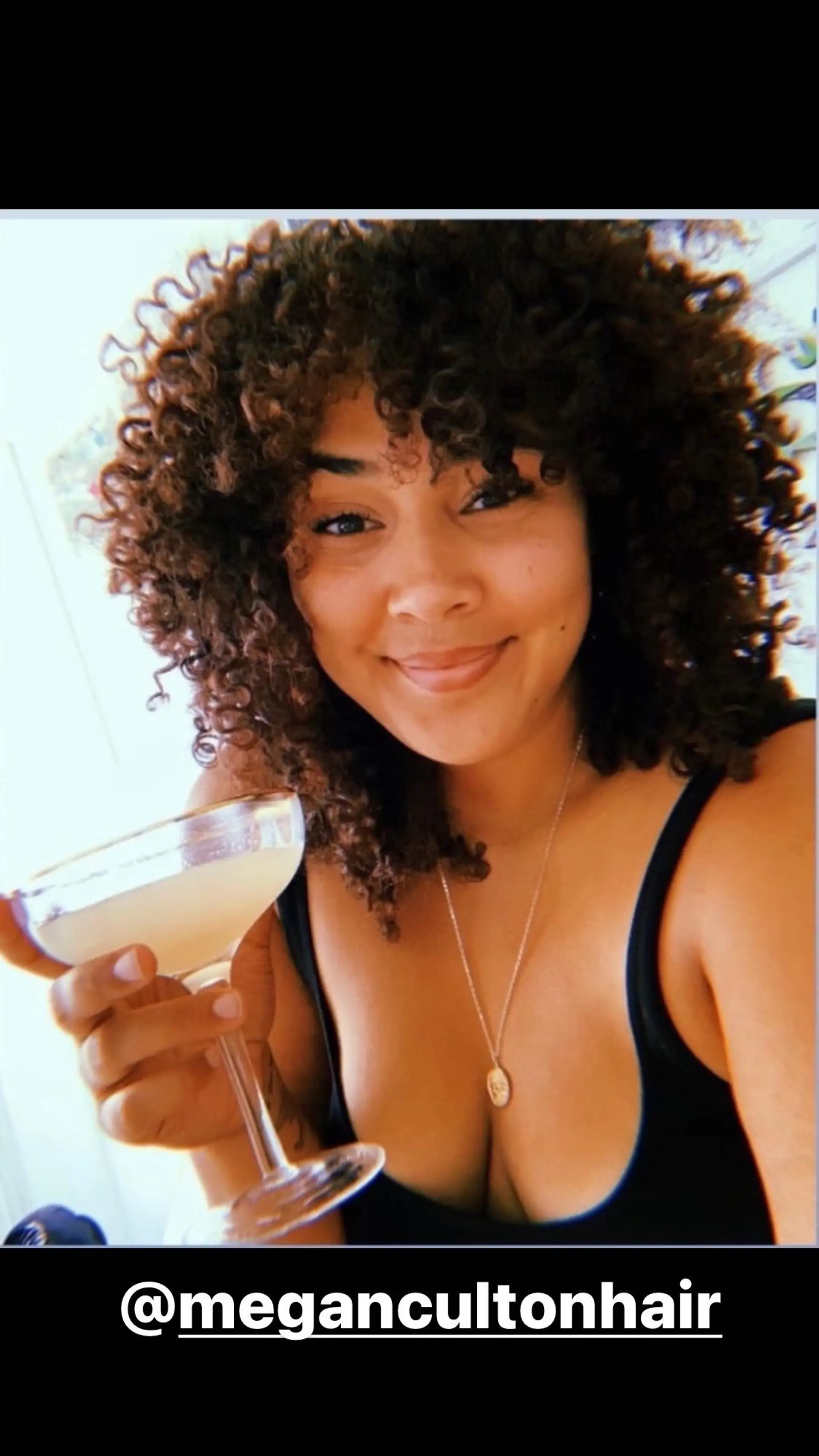 A voluminous, curly bob with natural texture. 1