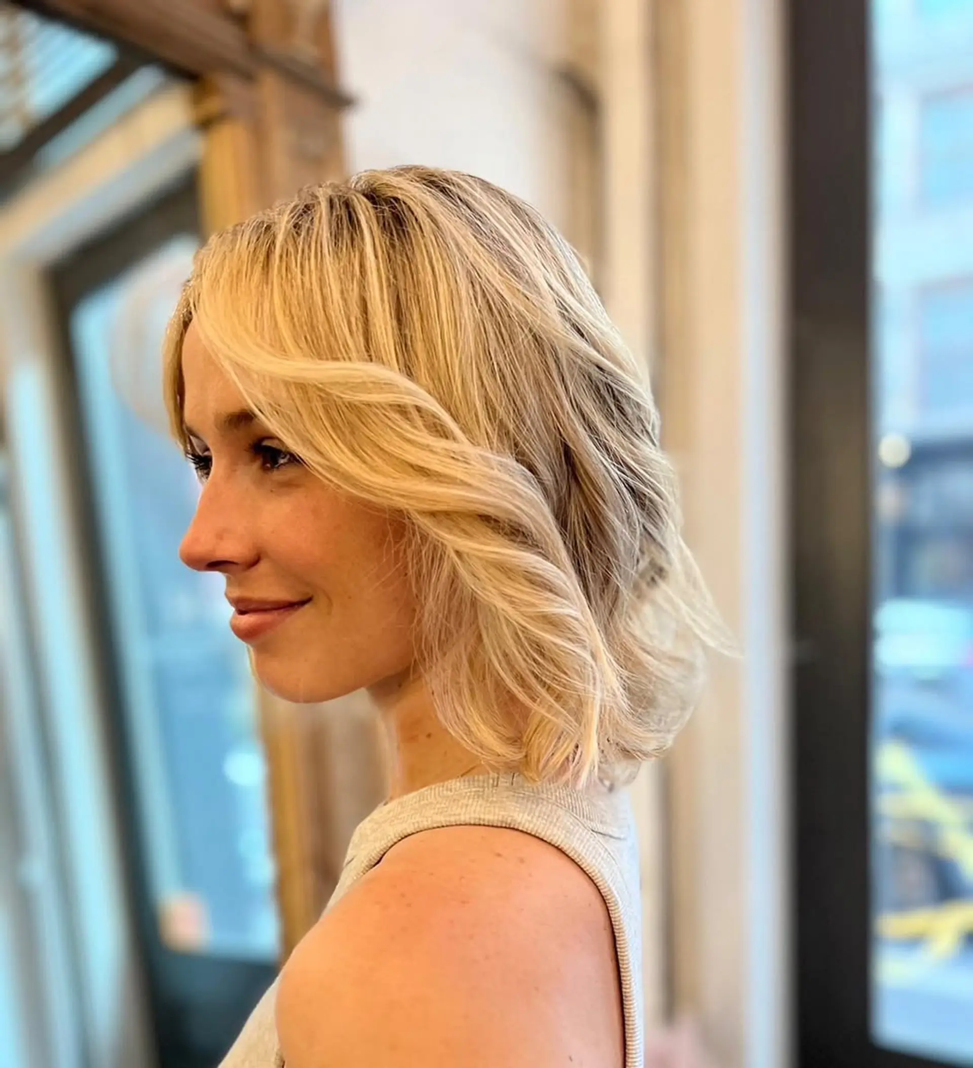 Medium-length wavy blonde hair with a layered cut, featuring soft waves and a side part with subtle highlights.

Color by Kaori. Cut by Taka. Style by Hazuki 1