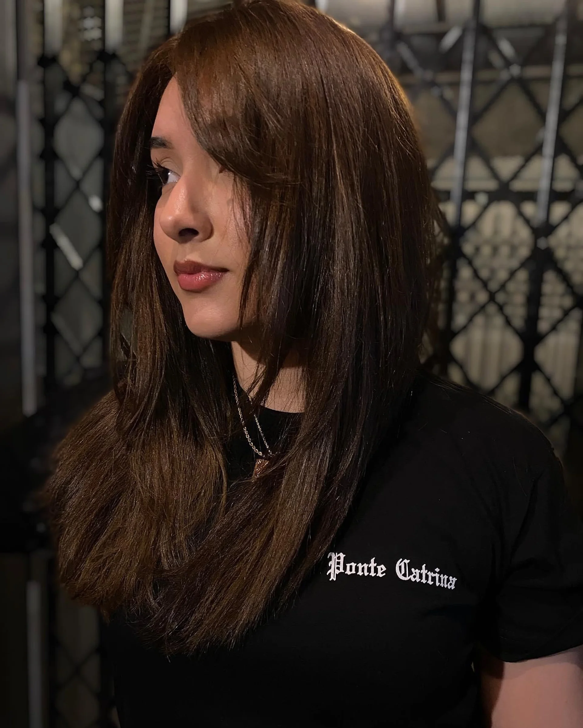 Long layered haircut with face-framing layers styled to showcase dimensional ash blonde color. - Preview 1