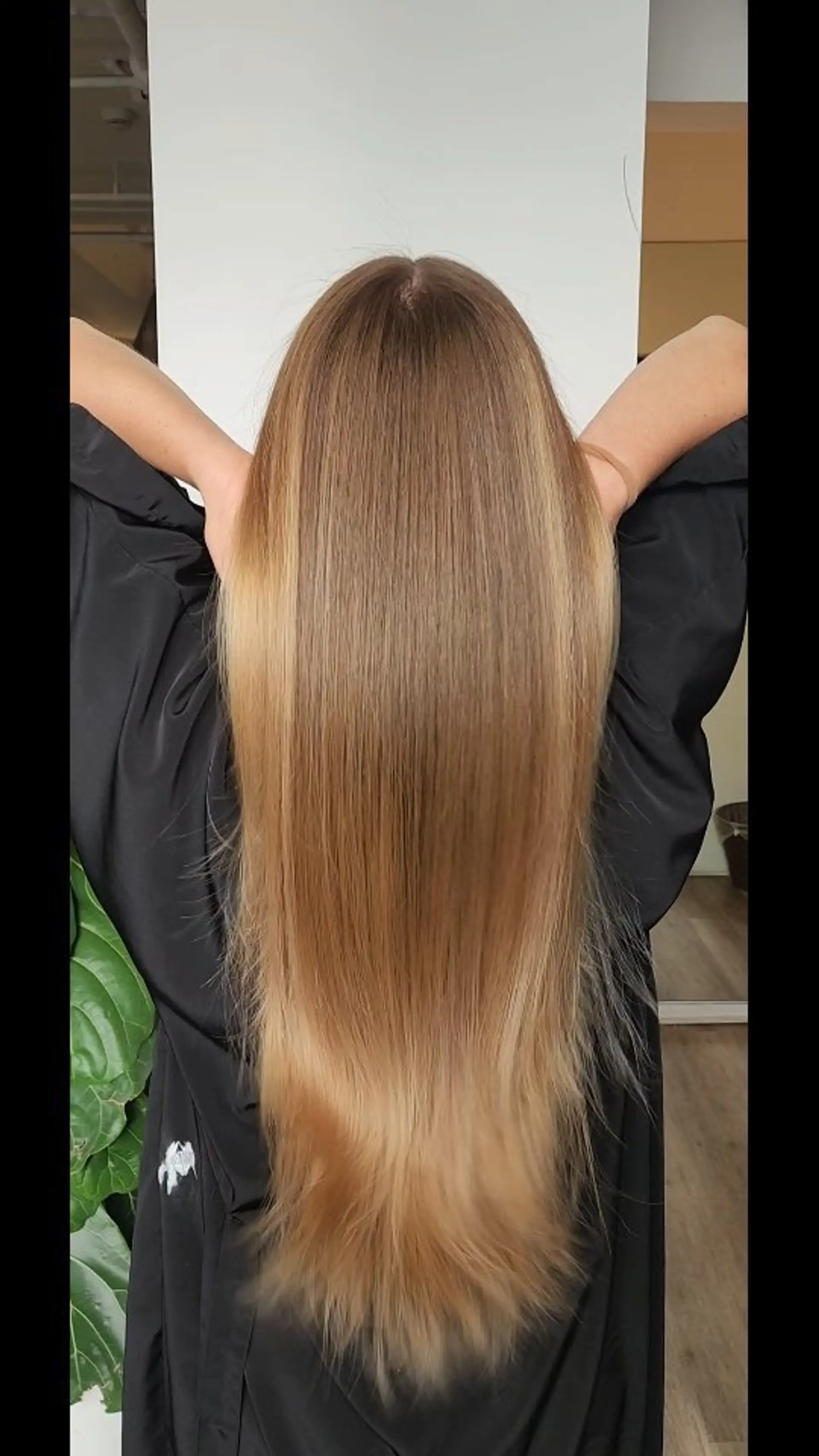Long, ultra-sleek straight hair with a high-shine finish and warm honey blonde tones. 1