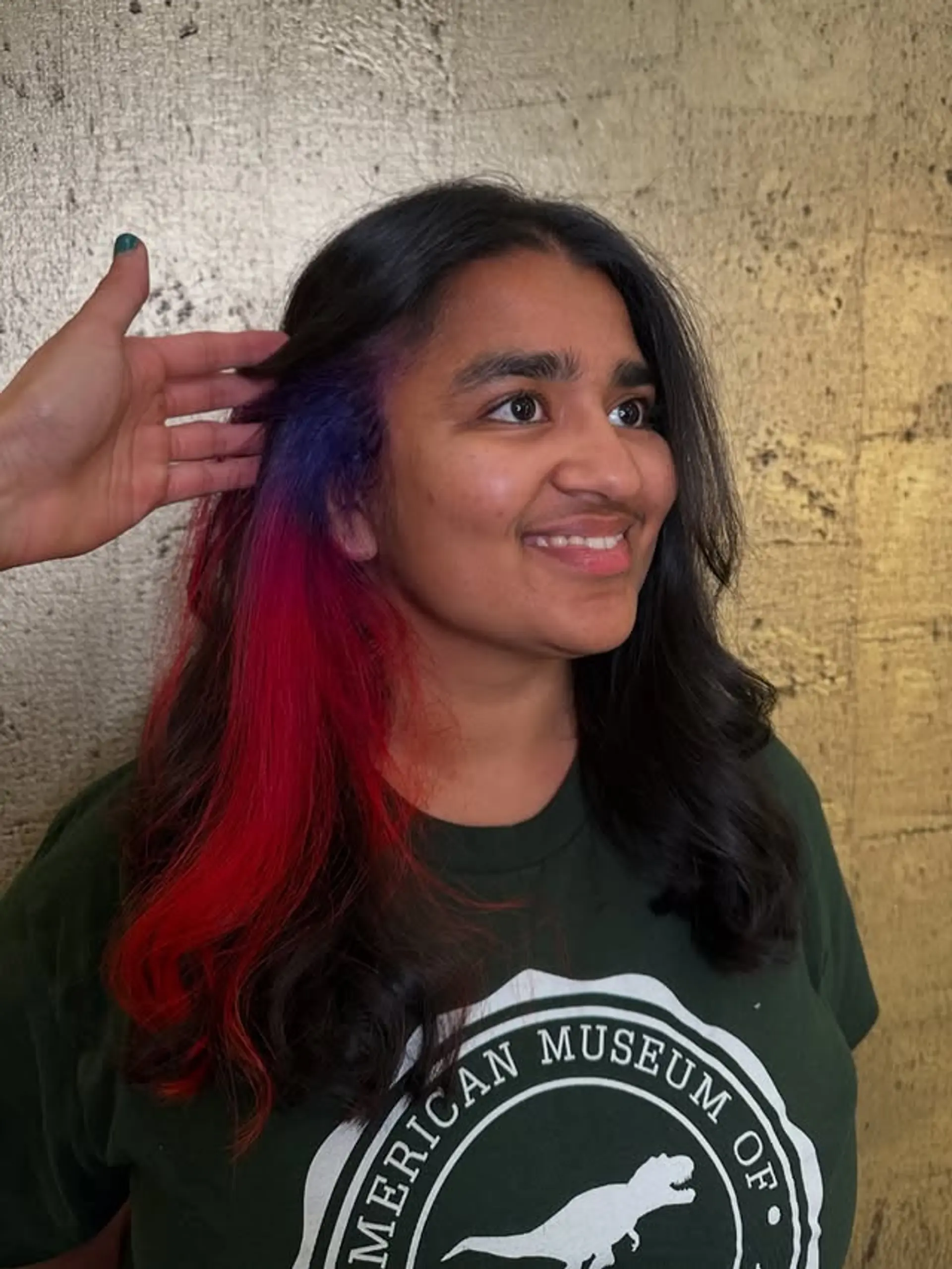 Long wavy hair with peekaboo highlights in vivid red and blue tones. 1