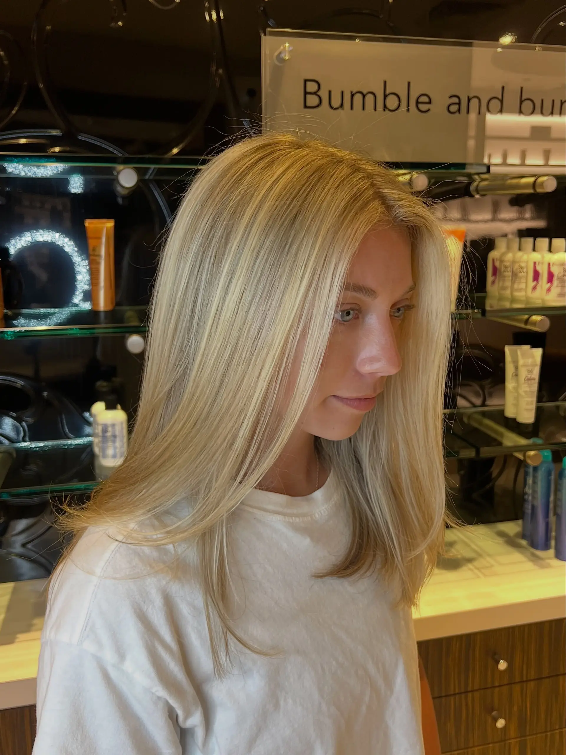 Straight, bright dimensional blonde hair with soft face-framing layers and smooth ends. 1