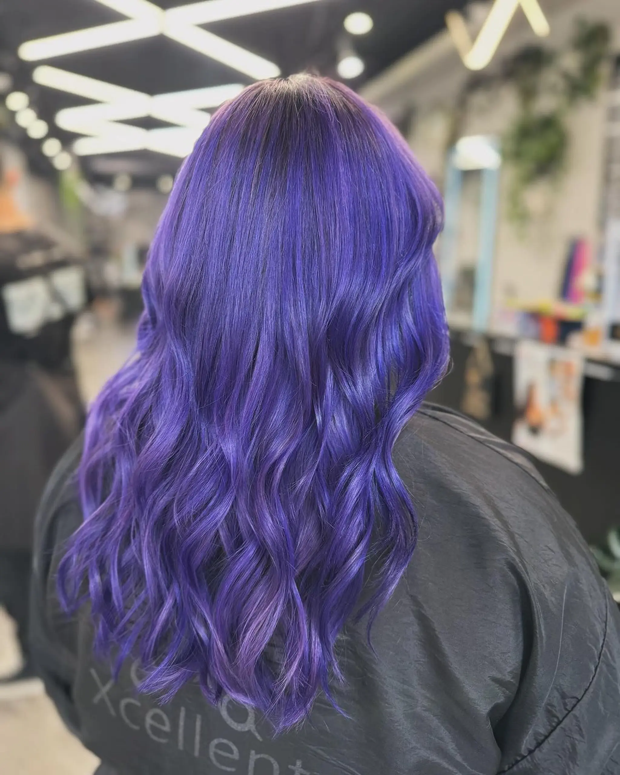 Long, wavy, vibrant purple hair with loose waves and a shiny finish.
Stylist - @xcellent_jason
