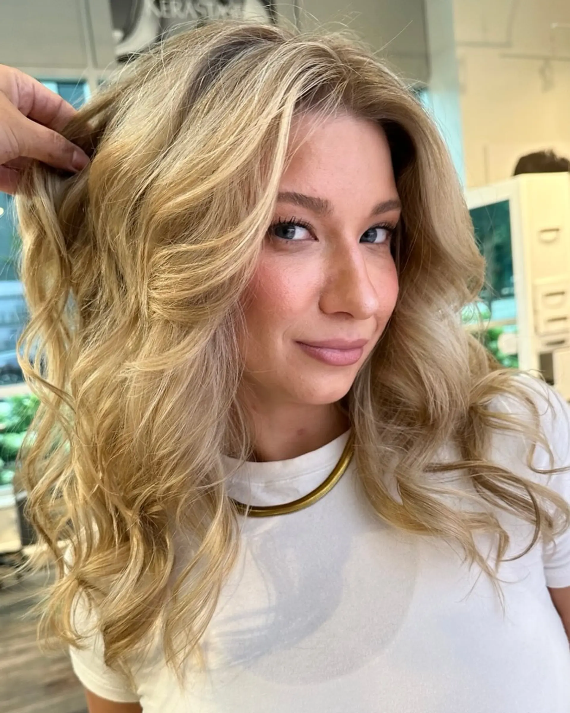 Medium length wavy hair with beachy waves and face framing layers. 1