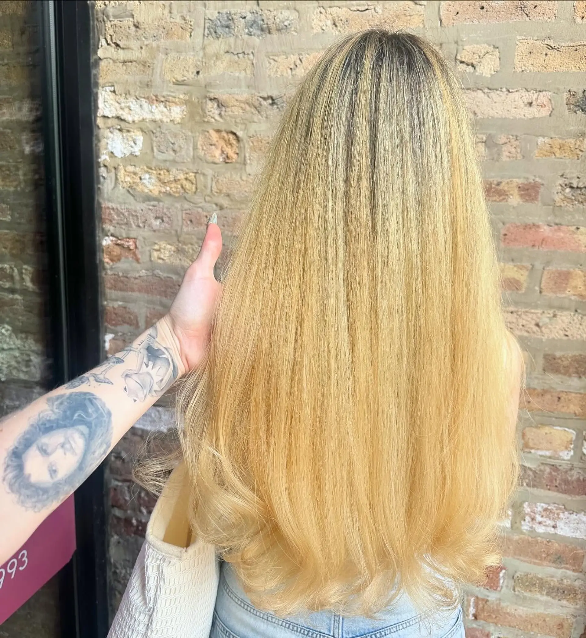 This hairstyle features long, straight hair with subtle layering to create movement and a soft, natural shape. 1