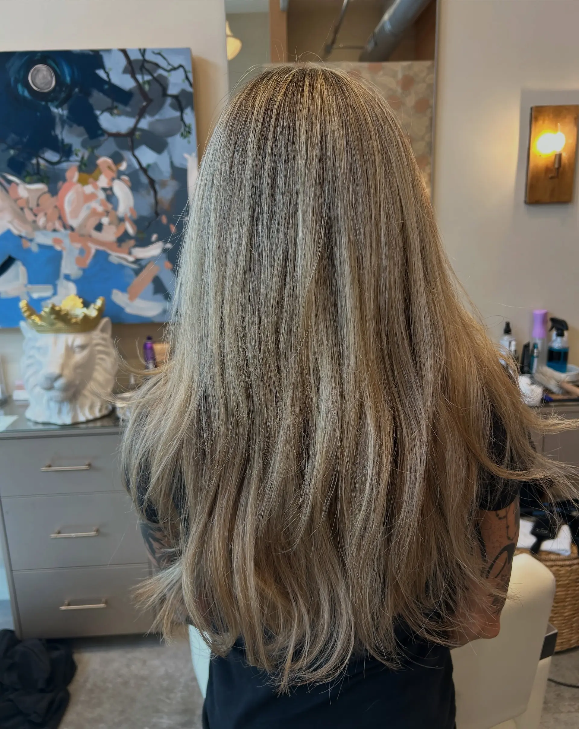 Long hair with fine ash blonde dimensional highlights, subtle layering, and a soft, smooth blowout. 1