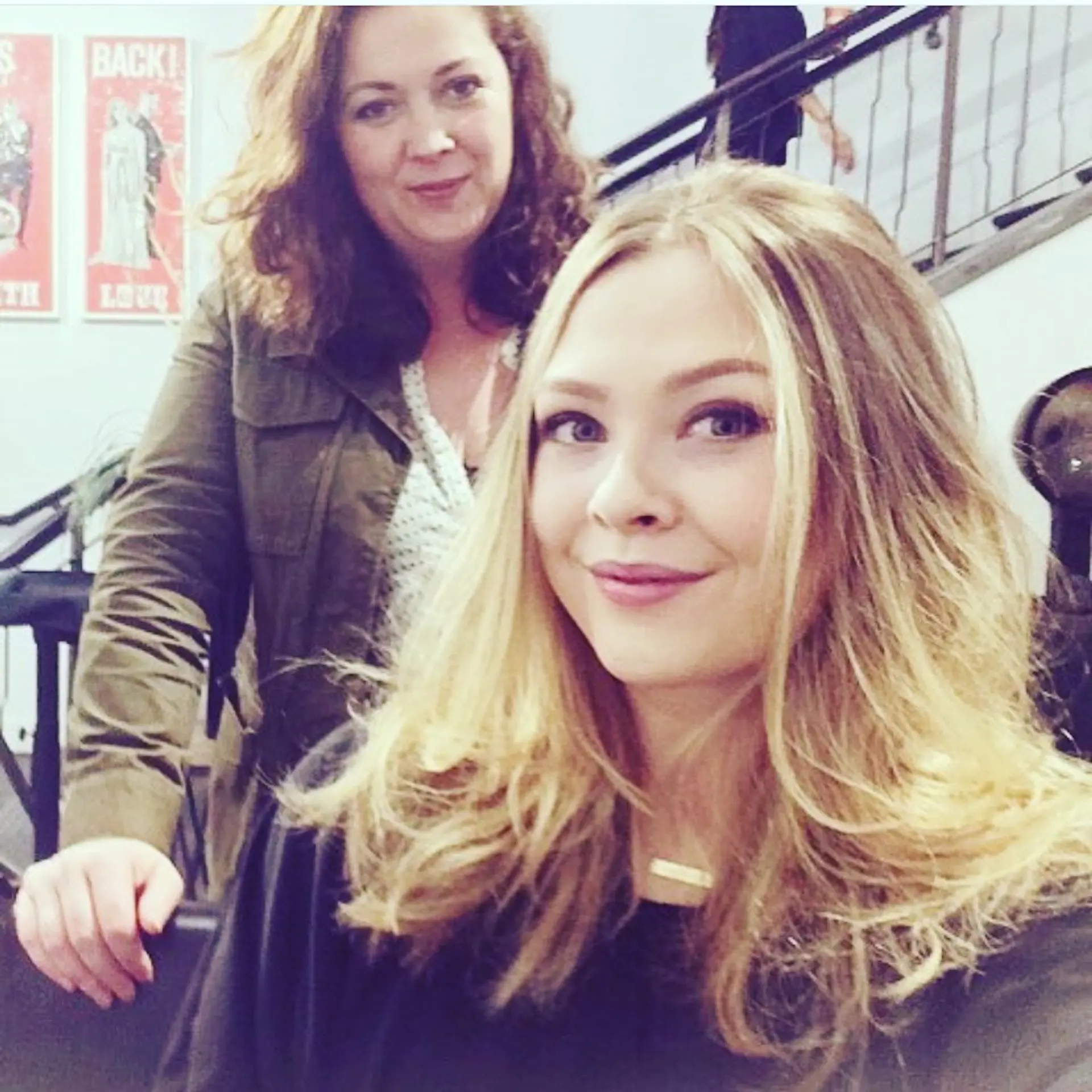 Medium-length layered golden blonde hair styled into effortless, undone waves with bright face-framing sections. 1