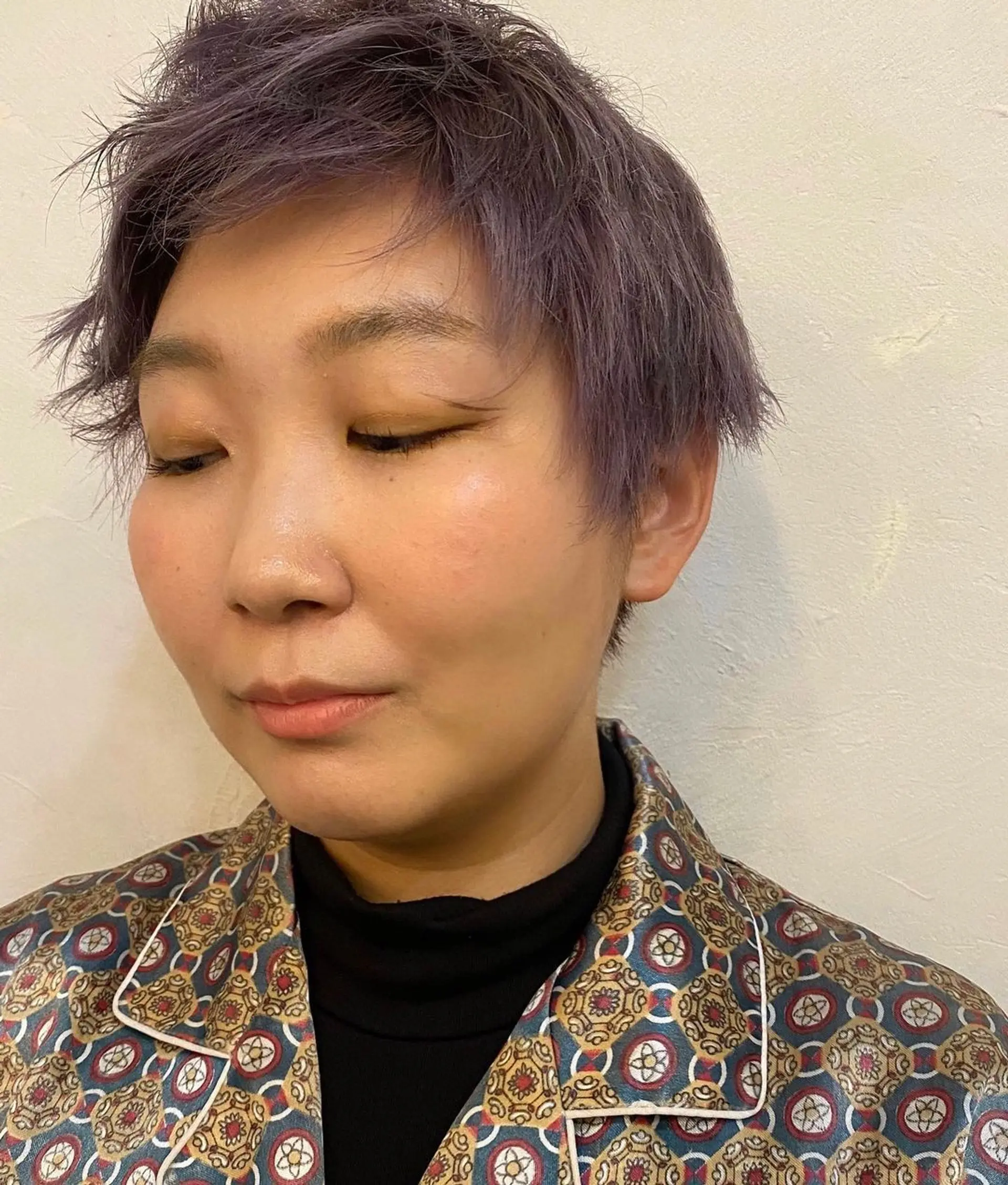 A playful and textured pixie cut with vibrant lavender color, featuring layers for added volume and a slightly tousled finish for an edgy look. (Hair by Coco) 1