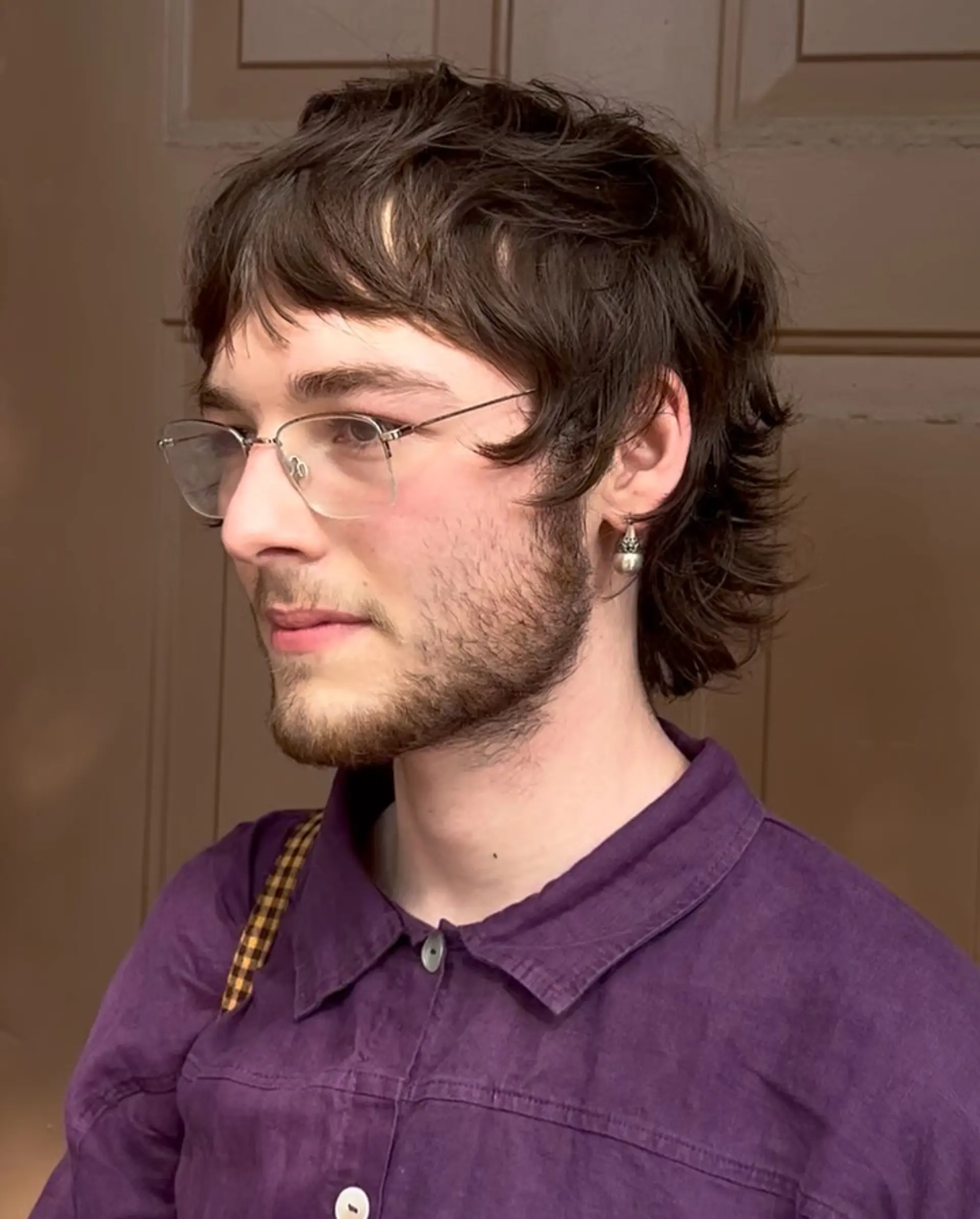 A textured mod mullet haircut with piecey front fringe and soft layers extending to the nape. 1