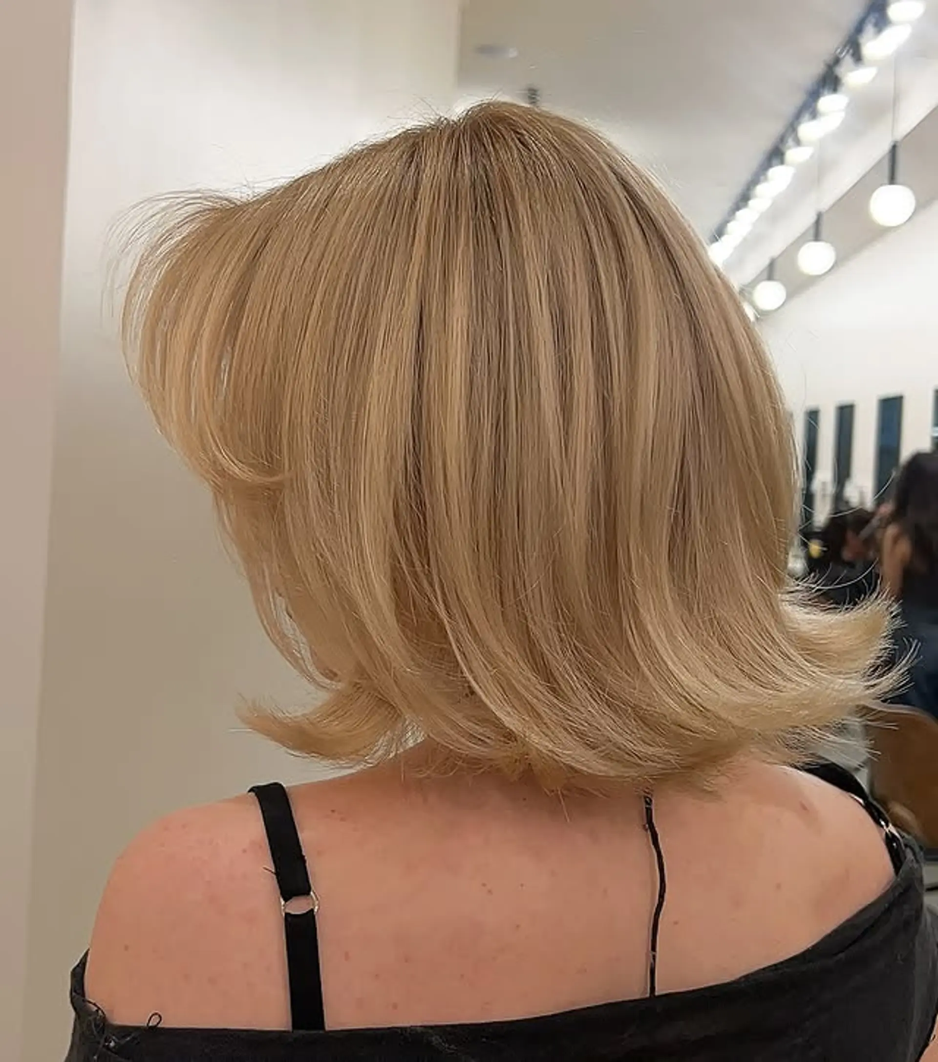 A chic, medium-length blunt bob with soft, face-framing layers. 1