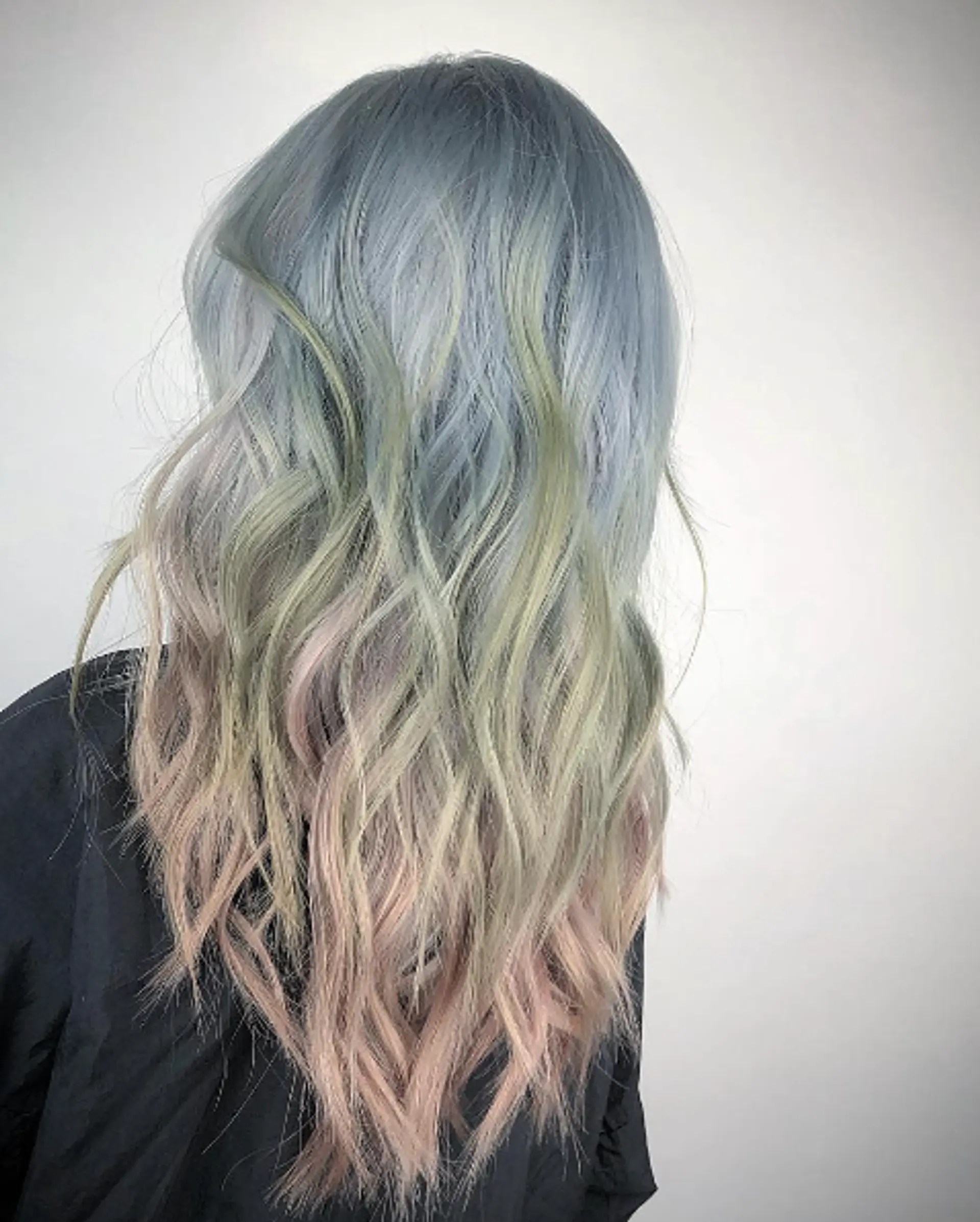 Long, wavy hairstyle with an ombre effect transitioning from silver to mint green to pastel pink. Loose waves offer a dreamy, ethereal appearance. 1