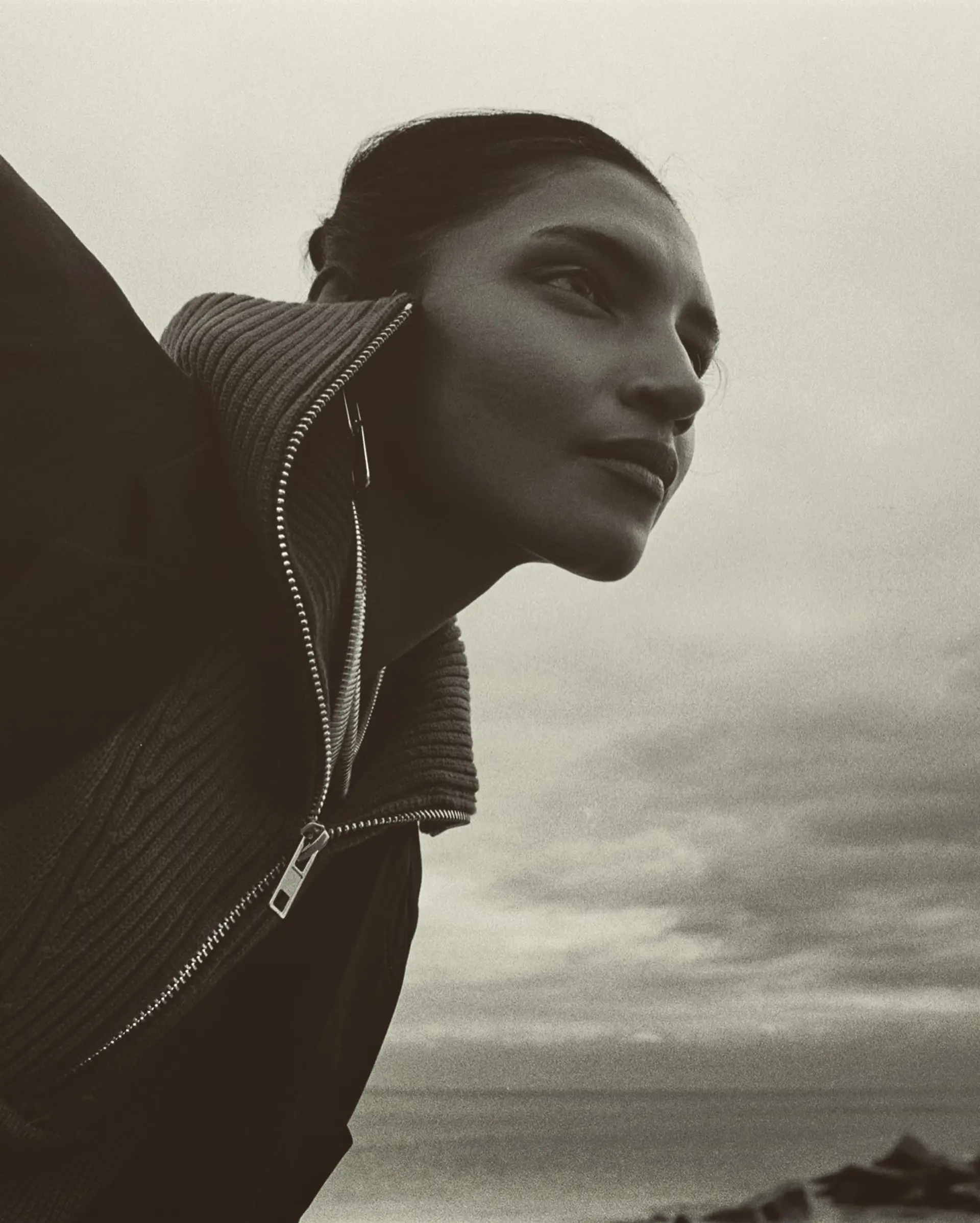 A sleek, slicked-back updo pulled cleanly into a neat low bun at the back. 1