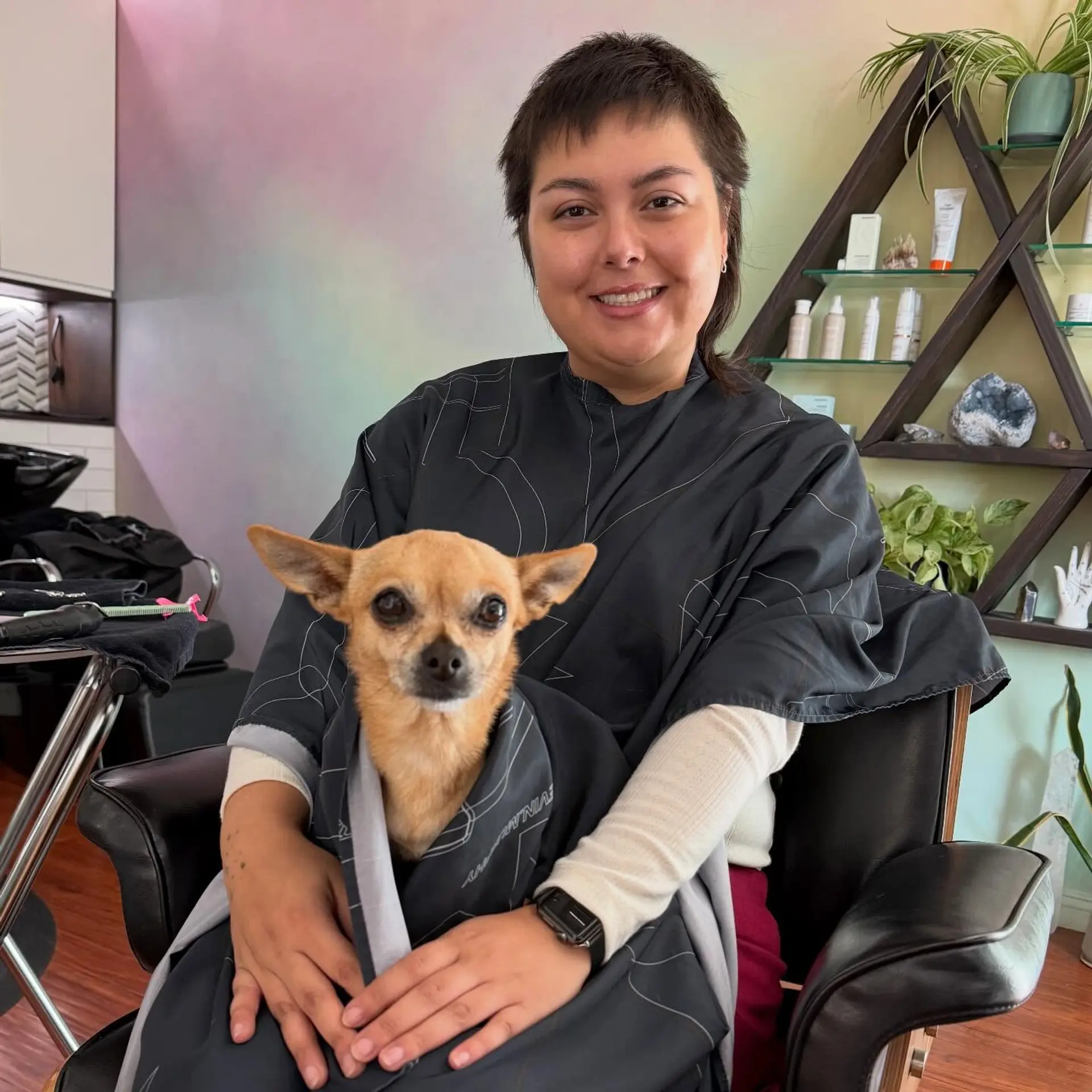 A short, textured pixie mullet featuring soft baby bangs and slightly longer, tapered layers at the nape. 1