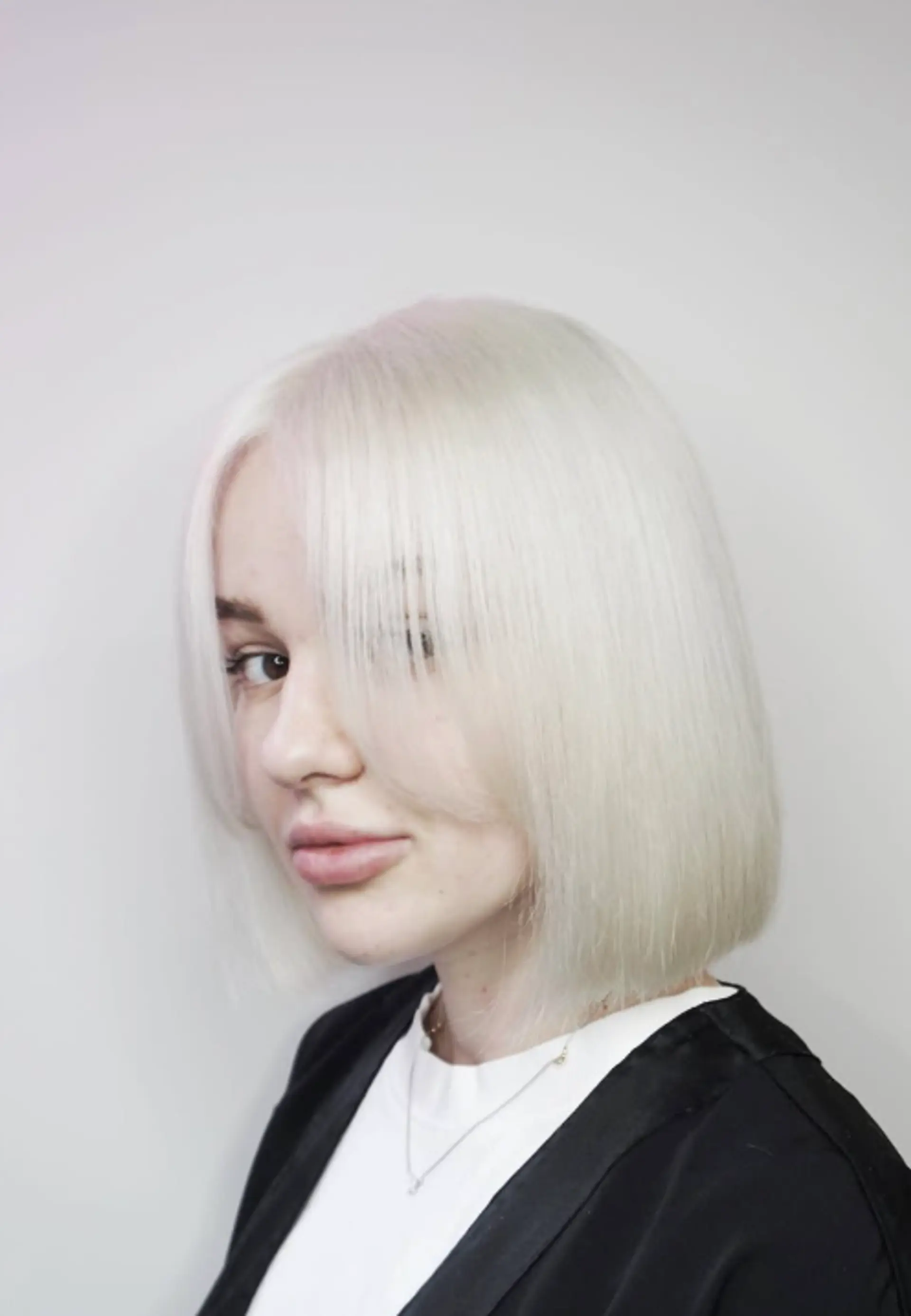 A trendy blunt bob haircut with short, baby bangs. 1